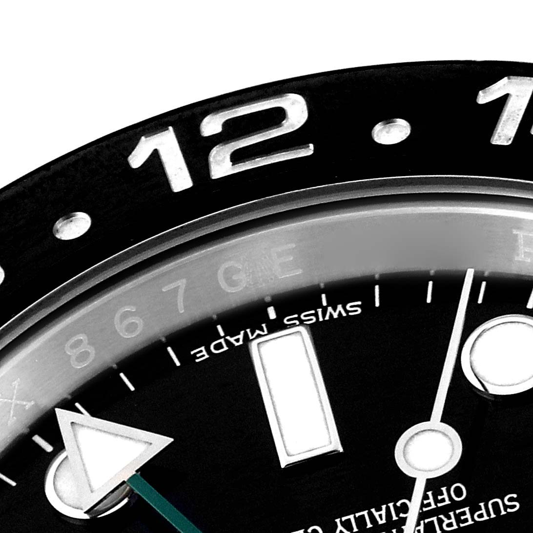 This close-up image shows the bezel indicators, dial markers, and hour hand of the Rolex GMT-Master 116710 Men
s Stainless Steel Black Dial 116710 Men
s Stainless Steel Black Dial watch.
