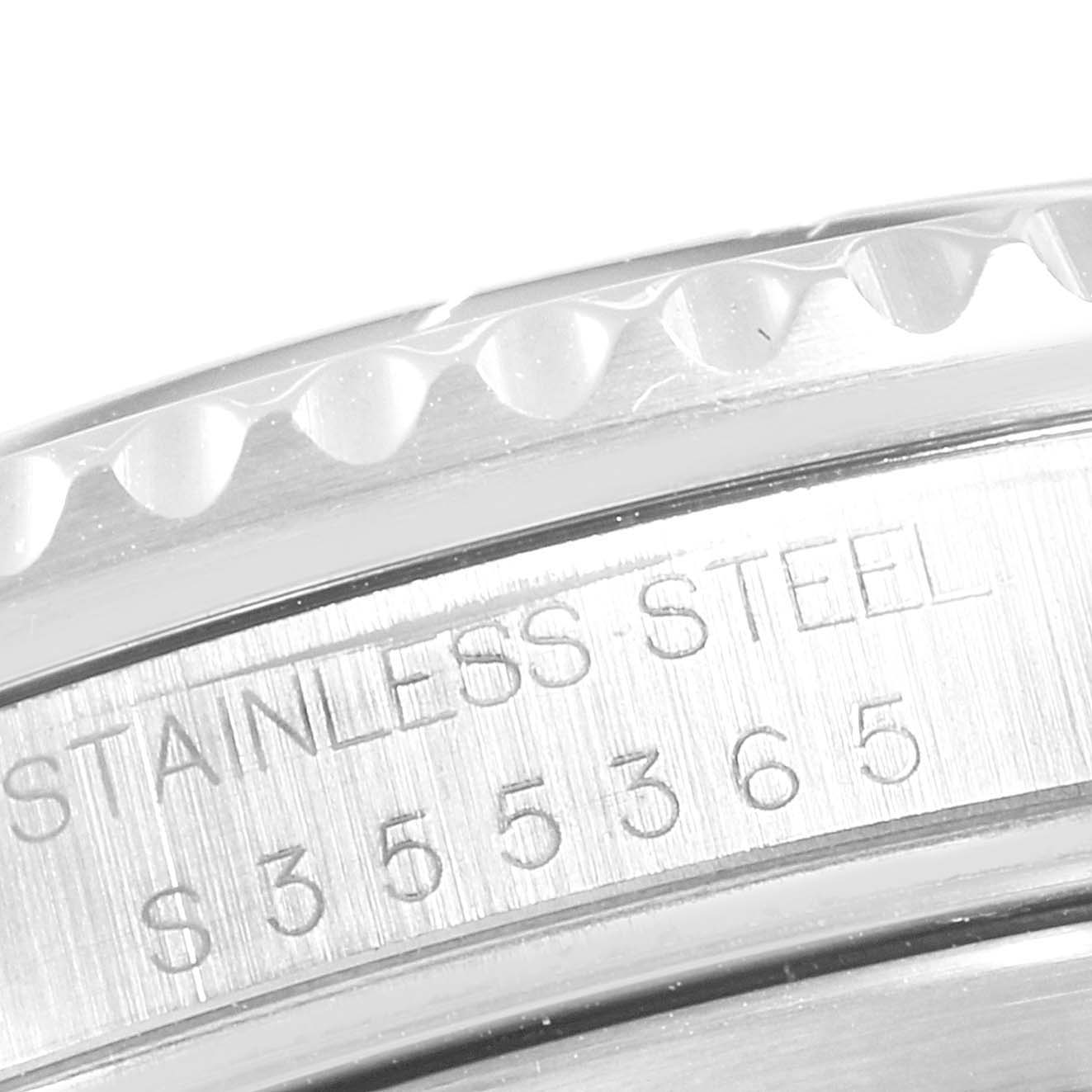 This close-up angle shows the stainless steel case and serial number engraving of a Rolex GMT-Master 16710 Men
s Stainless Steel Black Dial 16710 Men
s Stainless Steel Black Dial watch.