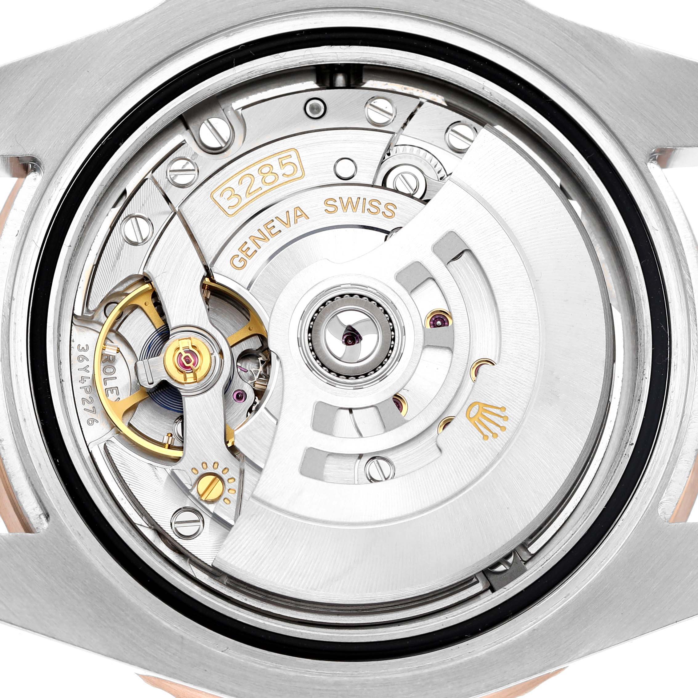 The image shows the movement of a Rolex GMT-Master M126711CHNR - 0002 Men's Steel and Gold (two tone) Black Dial, highlighting the intricate gears and rotor.