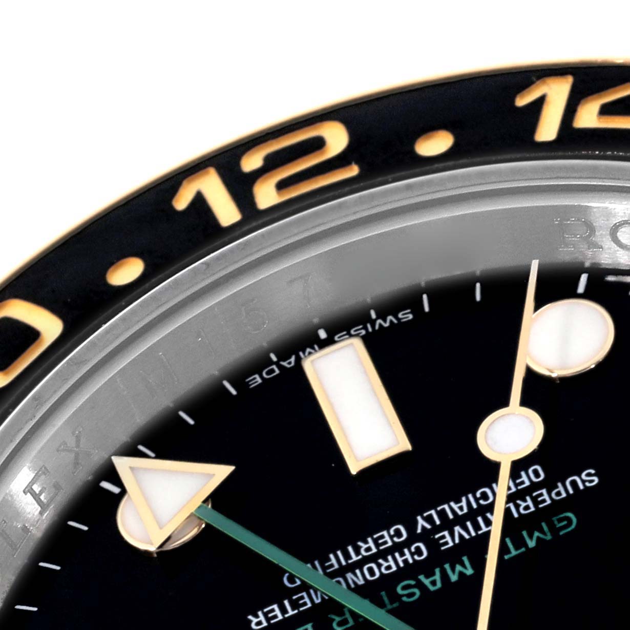 This image shows a close-up of the dial, bezel, and hour markers of a Rolex GMT-Master 116713 Men's Steel and Gold (two tone) Black Dial 116713 Men's Steel and Gold (two tone) Black Dial watch.