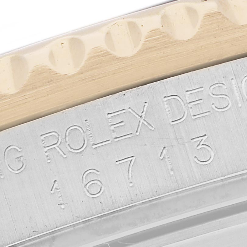 The image shows a close-up of the case side of a Rolex GMT-Master 16713 Men's Steel and Gold (two tone) Black Dial 16713 Men's Steel and Gold (two tone) Black Dial, highlighting the engraved model number.