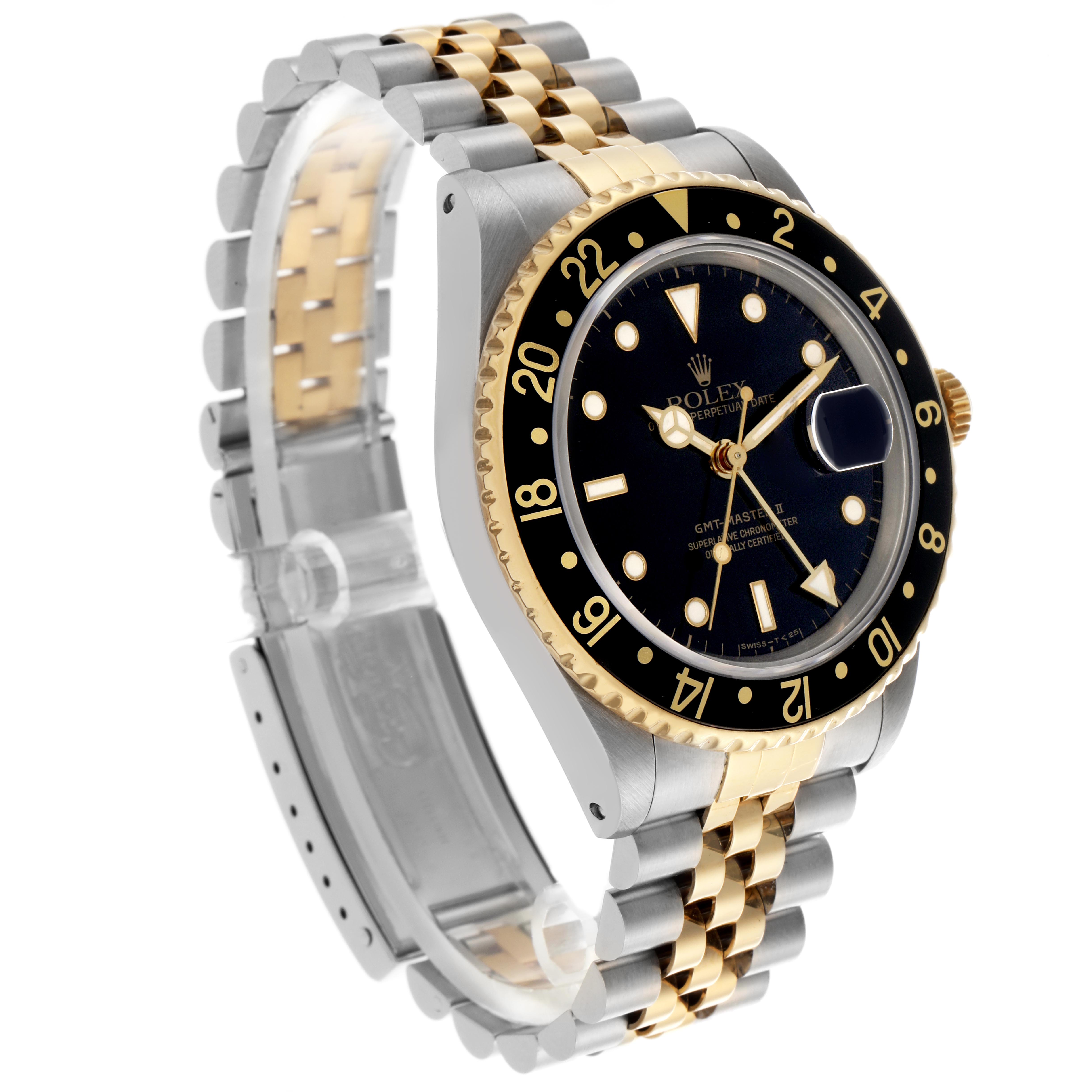 The Rolex GMT-Master 16713 Men's Steel and Gold (two tone) Black Dial 16713 Men's Steel and Gold (two tone) Black Dial is shown at a three-quarter angle, highlighting the dial, bezel, and two-tone bracelet.
