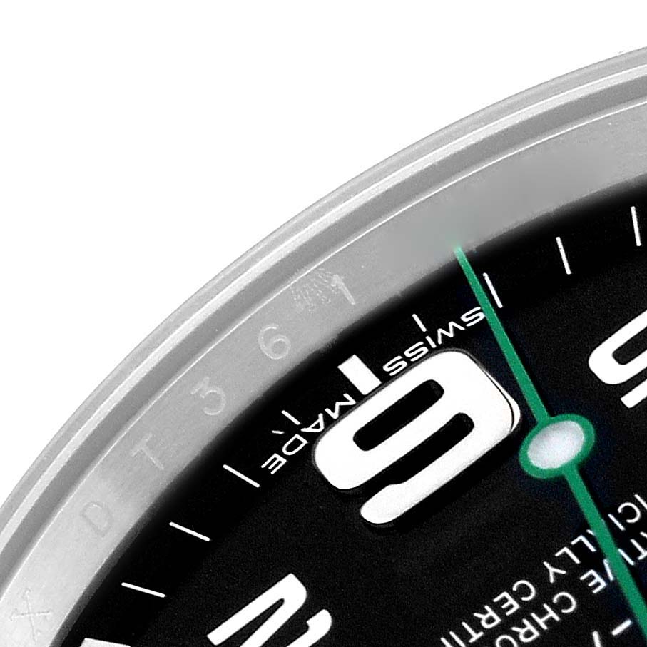 This close-up image of a Rolex Air-King 116900 Men's Stainless Steel Black Dial 116900 Men's Stainless Steel Black Dial watch shows part of the bezel, dial, and the number 9 in focus.