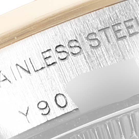 The image shows a close-up of the case edge with "STAINLESS STEEL" engraving on the Rolex Oyster Perpetual 76183 Women
s Steel and Gold (two tone) Grey Dial 76183 Women
s Steel and Gold (two tone) Grey Dial watch.