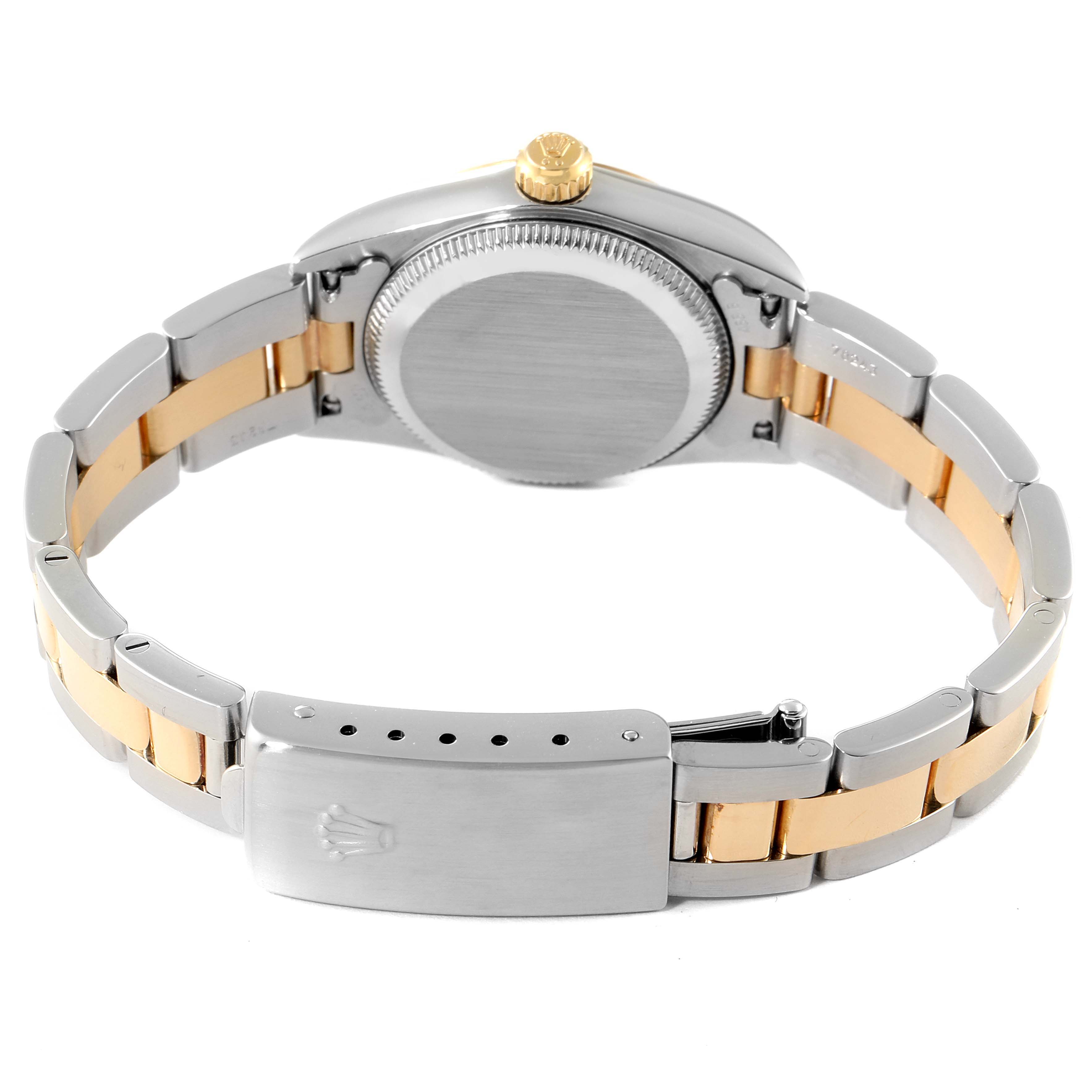 The image shows the back and partially open clasp of a Rolex Oyster Perpetual 76183 Women
s Steel and Gold (two tone) Grey Dial 76183 Women
s Steel and Gold (two tone) Grey Dial watch.