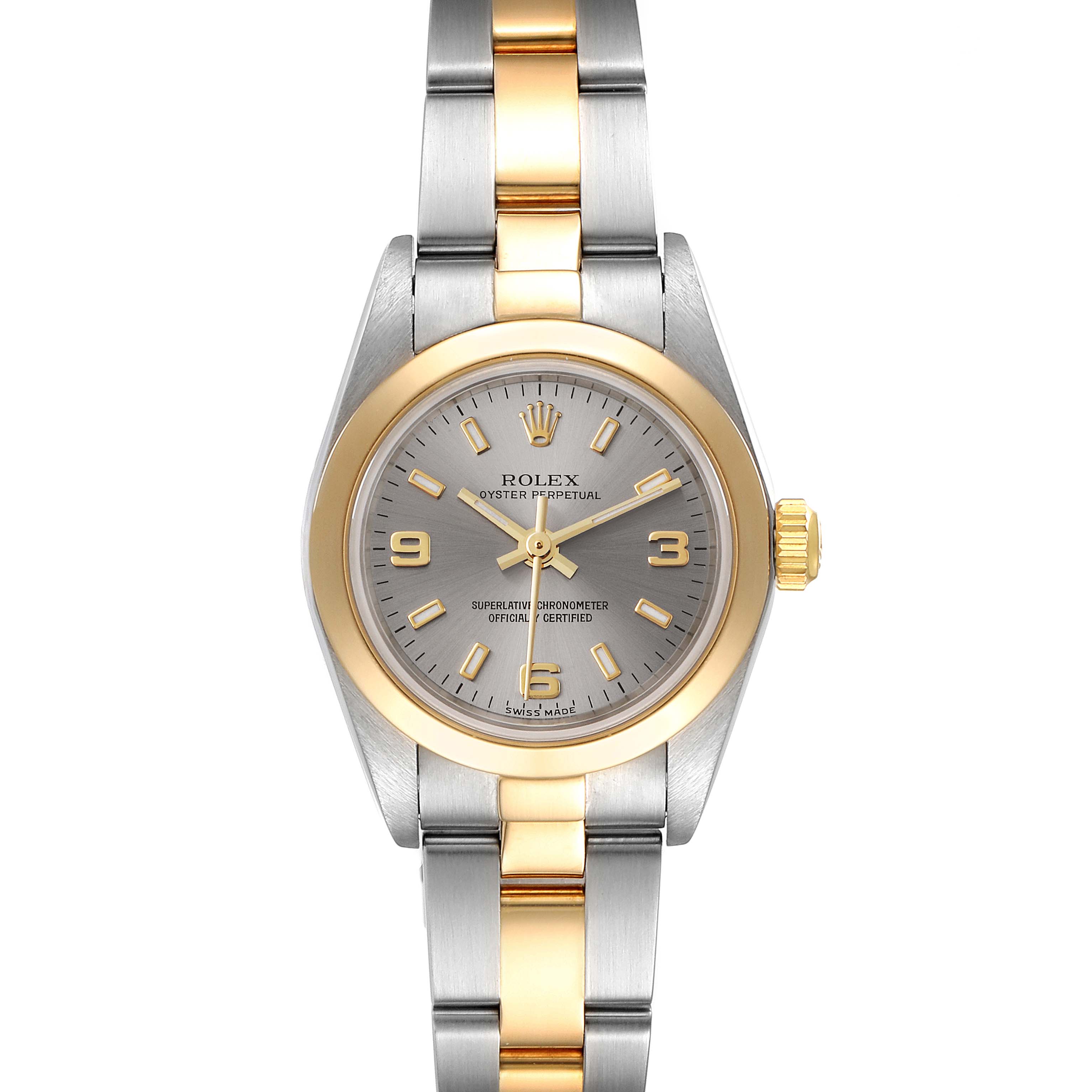 The image shows a front view of a Rolex Oyster Perpetual 76183 Women
s Steel and Gold (two tone) Grey Dial 76183 Women
s Steel and Gold (two tone) Grey Dial watch, highlighting the face, bezel, and bracelet.