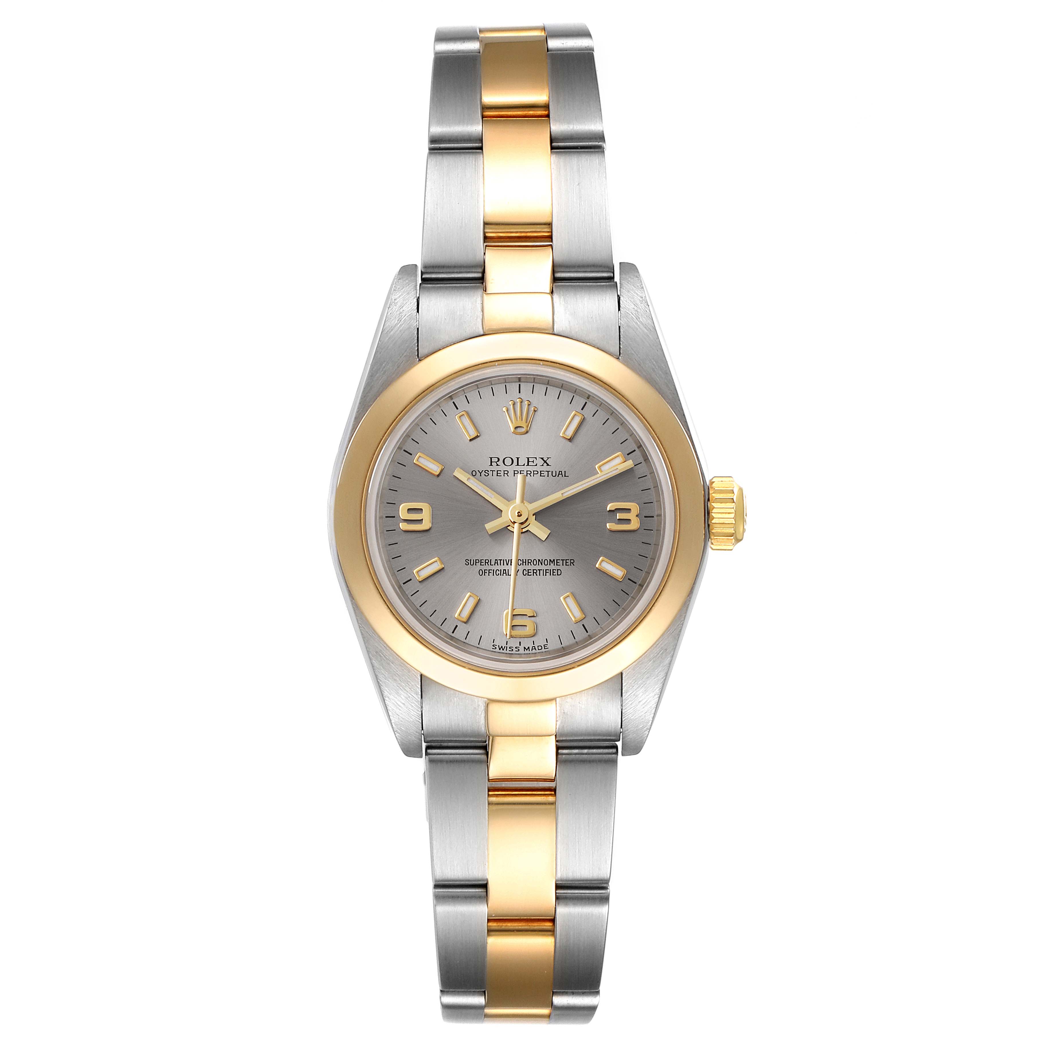 The image shows a front view of a Rolex Oyster Perpetual 76183 Women
s Steel and Gold (two tone) Grey Dial 76183 Women
s Steel and Gold (two tone) Grey Dial watch, featuring a gold and silver two-tone design.