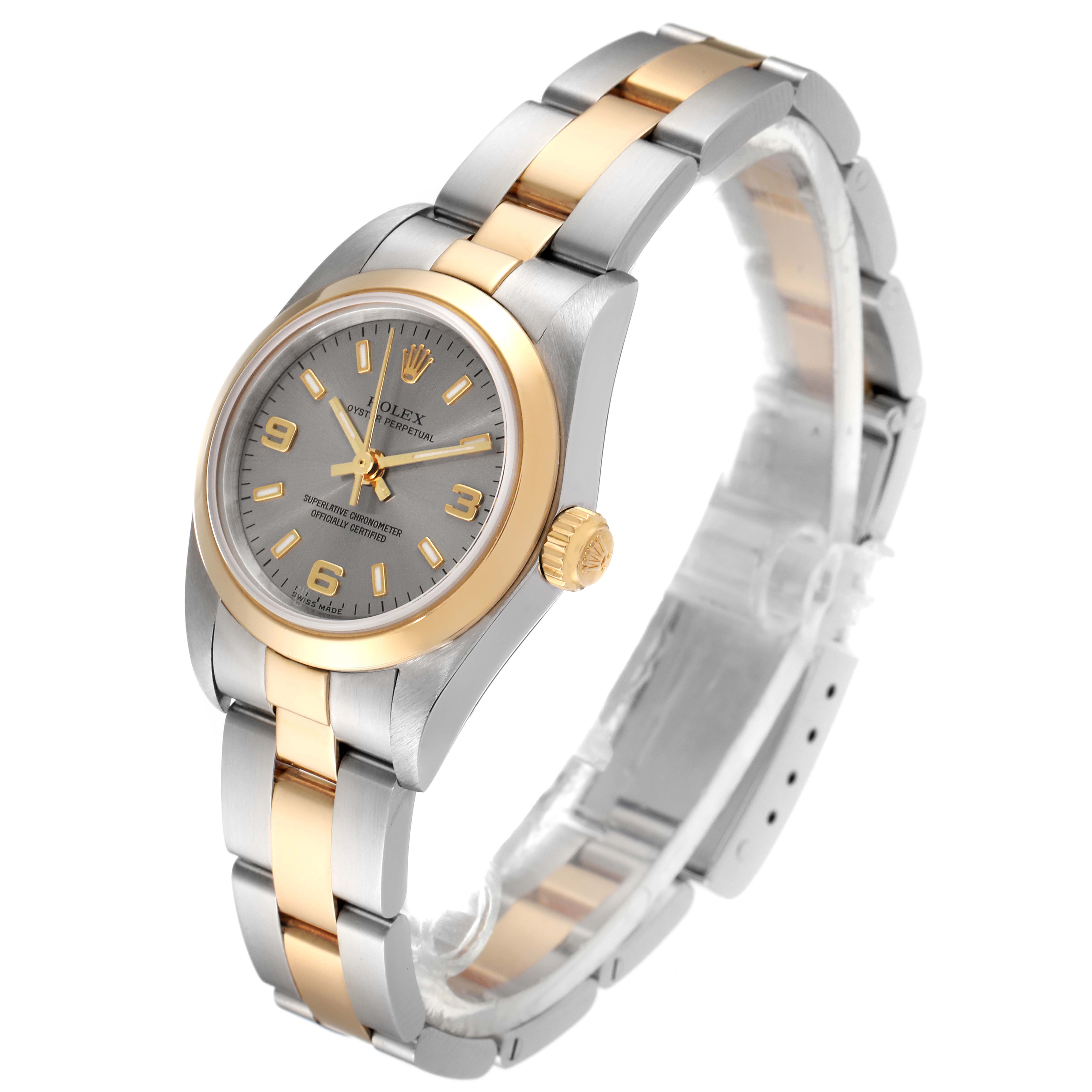 The Rolex Oyster Perpetual 76183 Women
s Steel and Gold (two tone) Grey Dial 76183 Women
s Steel and Gold (two tone) Grey Dial watch is shown at a slight angle highlighting its two-tone bracelet, dial, and crown.