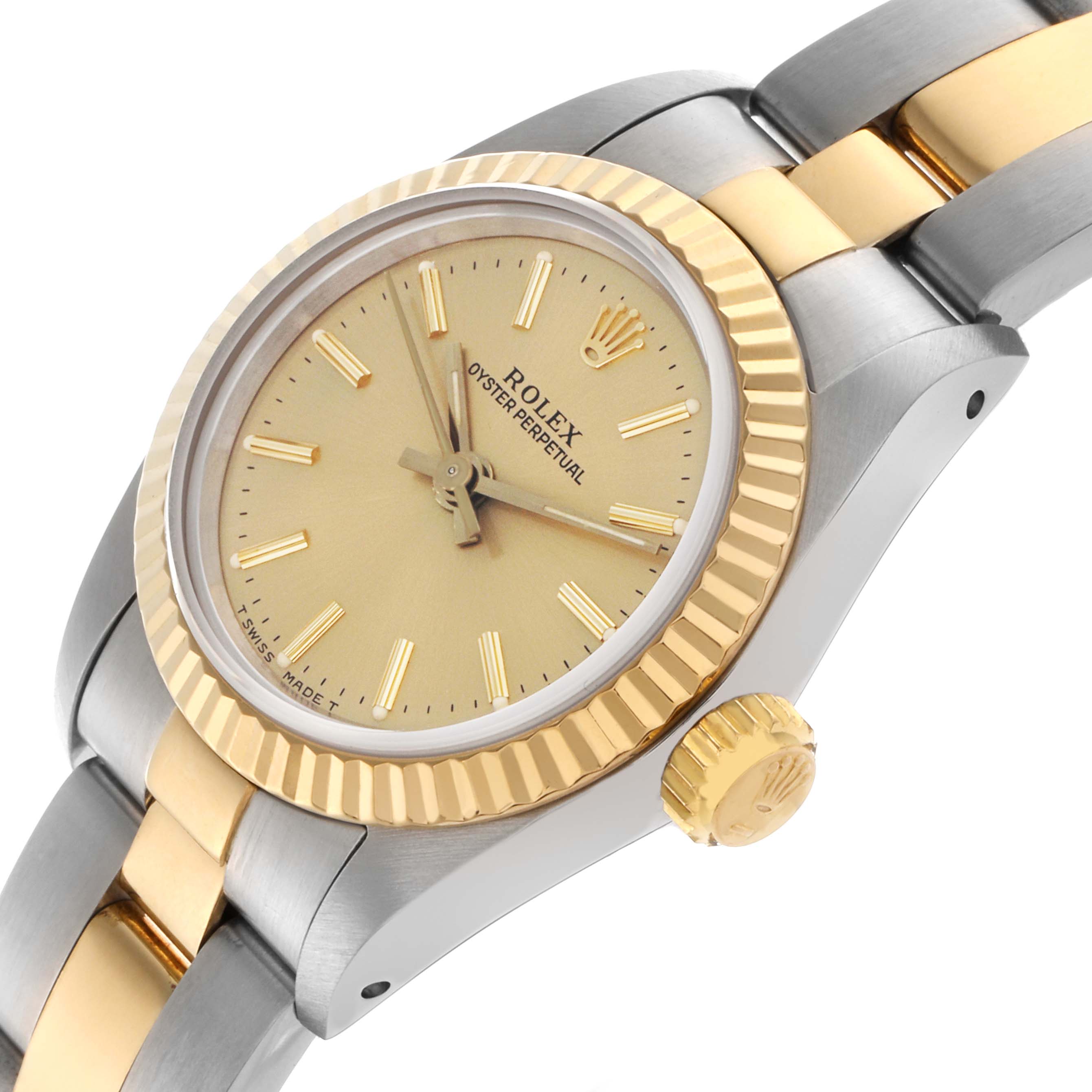 The Rolex Oyster Perpetual 67193 Women's Steel and Gold (two tone) Champagne Dial 67193 Women's Steel and Gold (two tone) Champagne Dial watch is shown from a side angle, highlighting the gold bezel, crown, face, and two-tone bracelet.