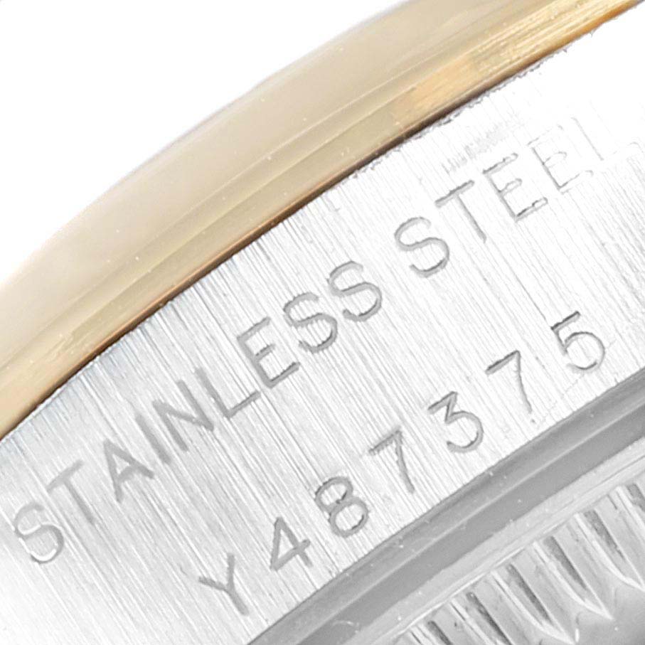 This close-up image shows the serial number and "STAINLESS STEEL" text on the side case of the Rolex Oyster Perpetual 76183 Women's Steel and Gold (two tone) Silver Dial 76183 Women's Steel and Gold (two tone) Silver Dial watch.