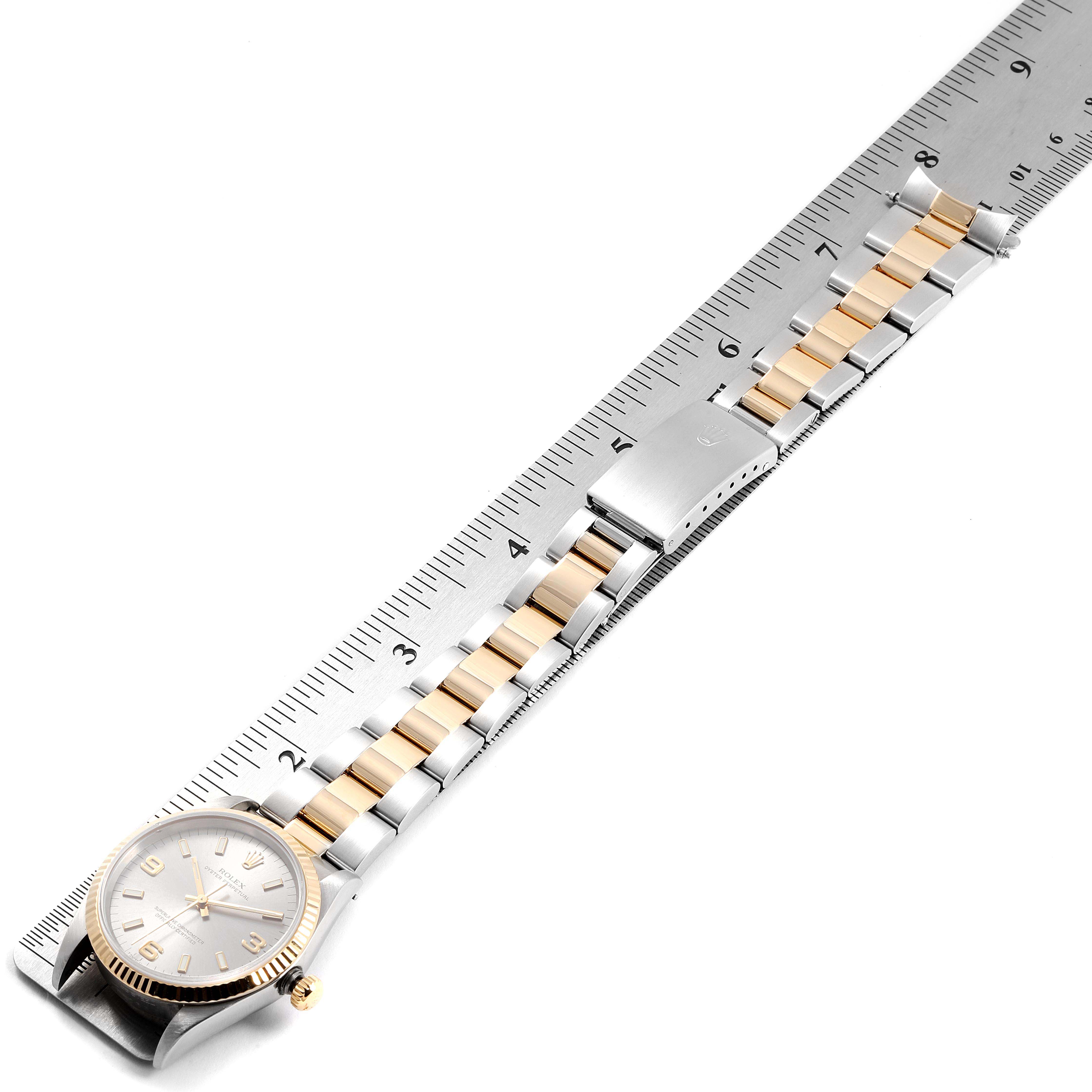 The image shows a side angle of a Rolex Oyster Perpetual 14233 Men's Steel and Gold (two tone) Grey Dial 14233 Men's Steel and Gold (two tone) Grey Dial watch, highlighting its dial, bracelet, and clasp.