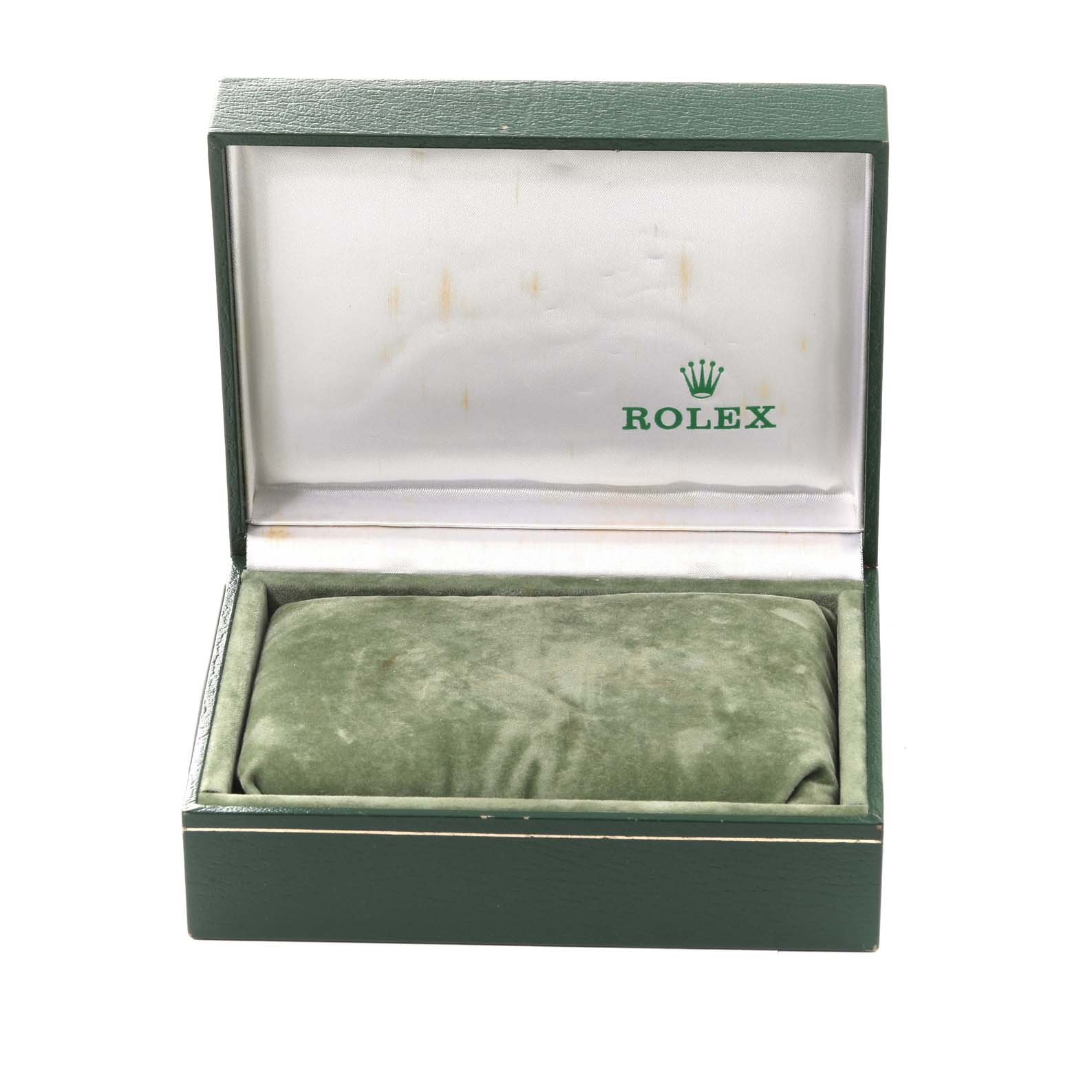 This image shows an open Rolex Vintage Collection 6694 Men's Stainless Steel Silver Dial 6694 Men's Stainless Steel Silver Dial watch box with a green cushion inside.