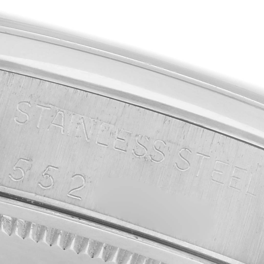 The image shows a close-up, angled view of the stainless steel case back of a Rolex Date 6694 Men's Stainless Steel Silver Dial 6694 Men's Stainless Steel Silver Dial model.