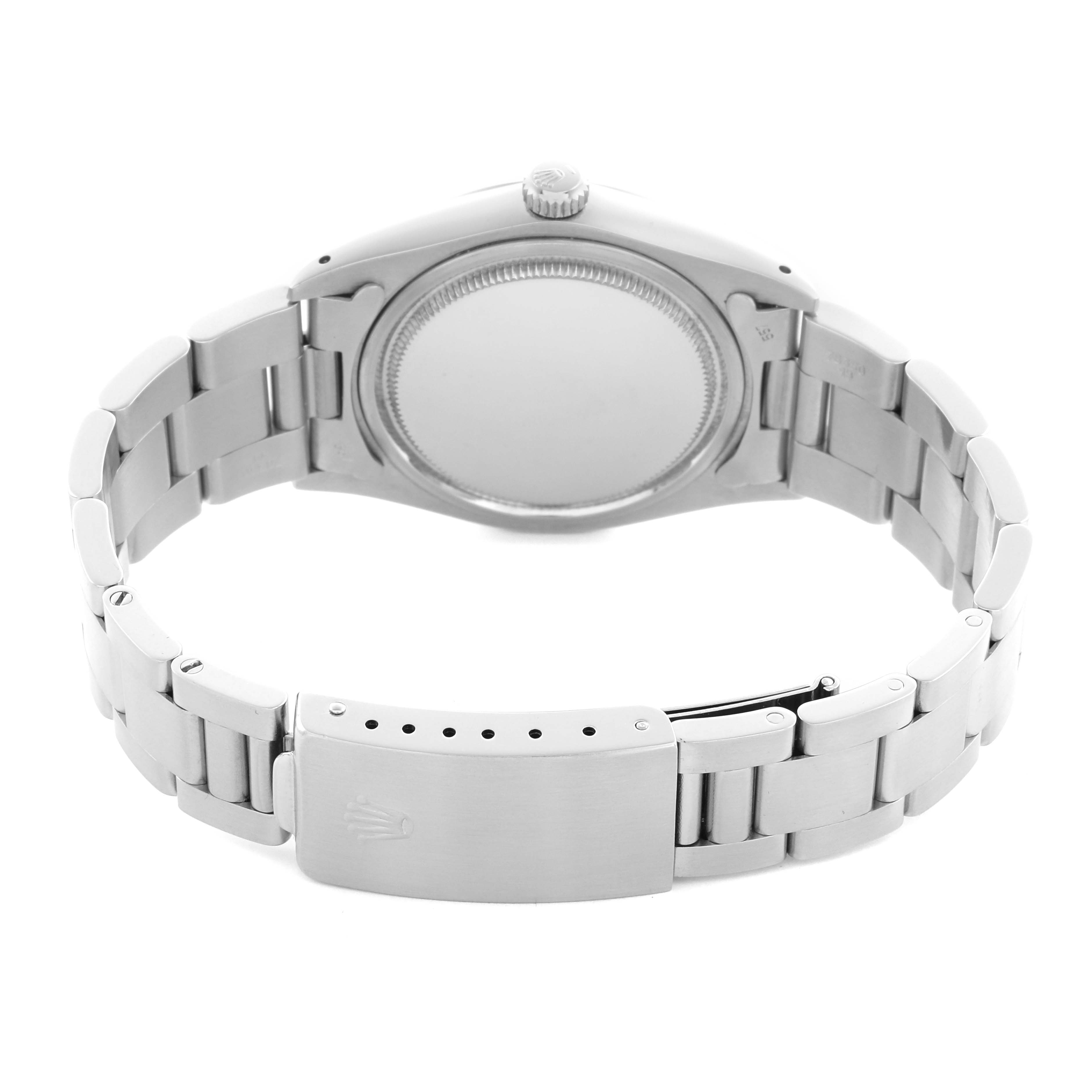 The Rolex Date 6694 Men's Stainless Steel Silver Dial 6694 Men's Stainless Steel Silver Dial watch is shown from the back, displaying its case back, crown, and closed bracelet clasp.