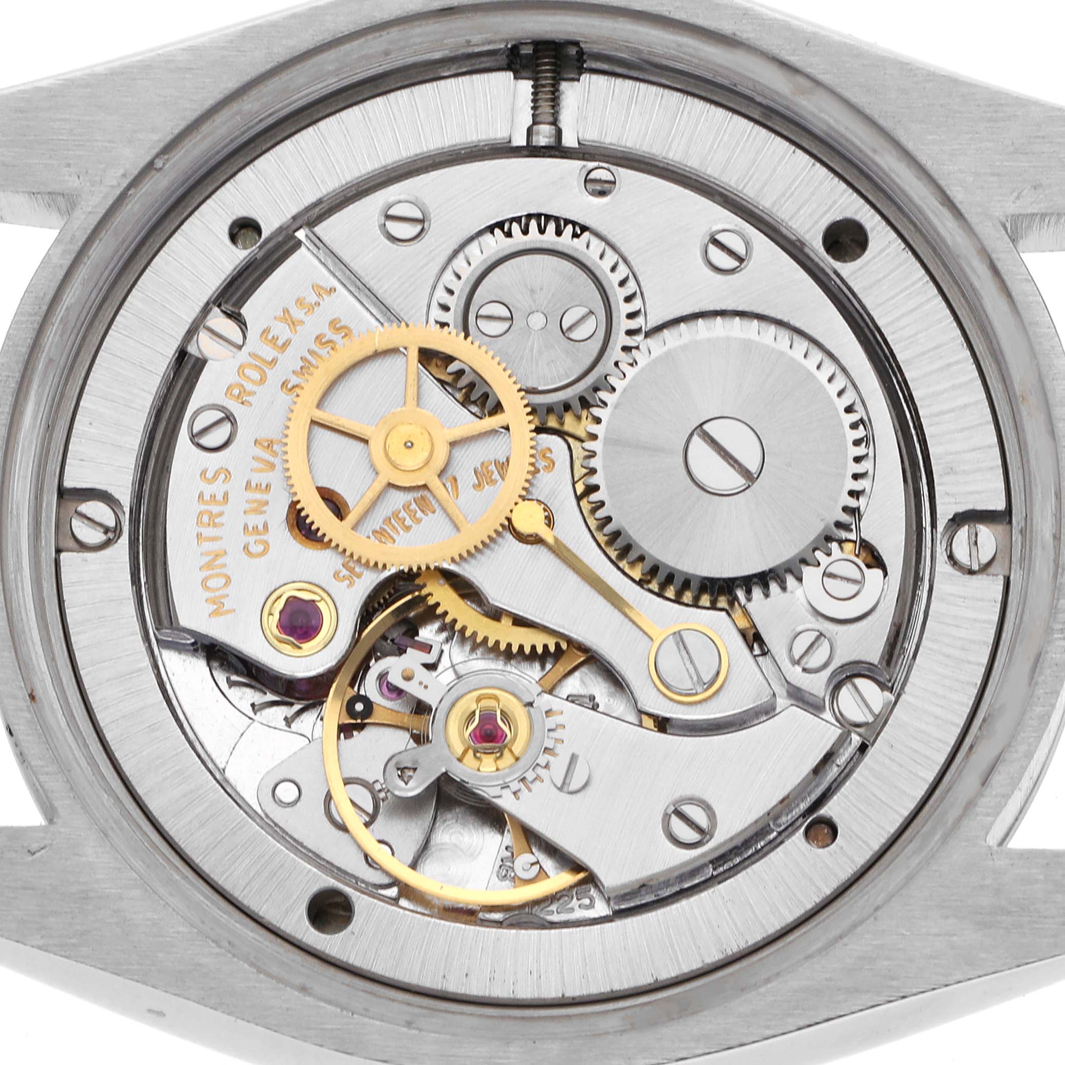 The image shows the movement of a Rolex Date 6694 Men's Stainless Steel Silver Dial 6694 Men's Stainless Steel Silver Dial model watch, highlighting gears and inner mechanics.