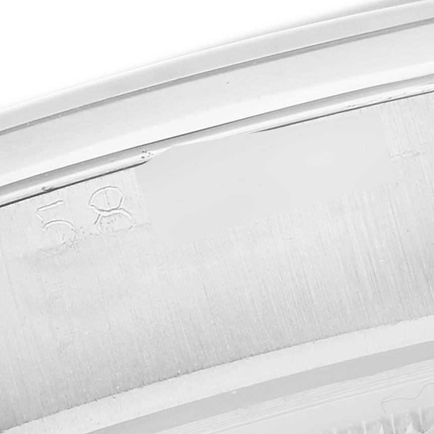 The image shows the inside edge and part of the case back of a Rolex Date 6694 Men's Stainless Steel Silver Dial 6694 Men's Stainless Steel Silver Dial model, focusing on engraved numbers.