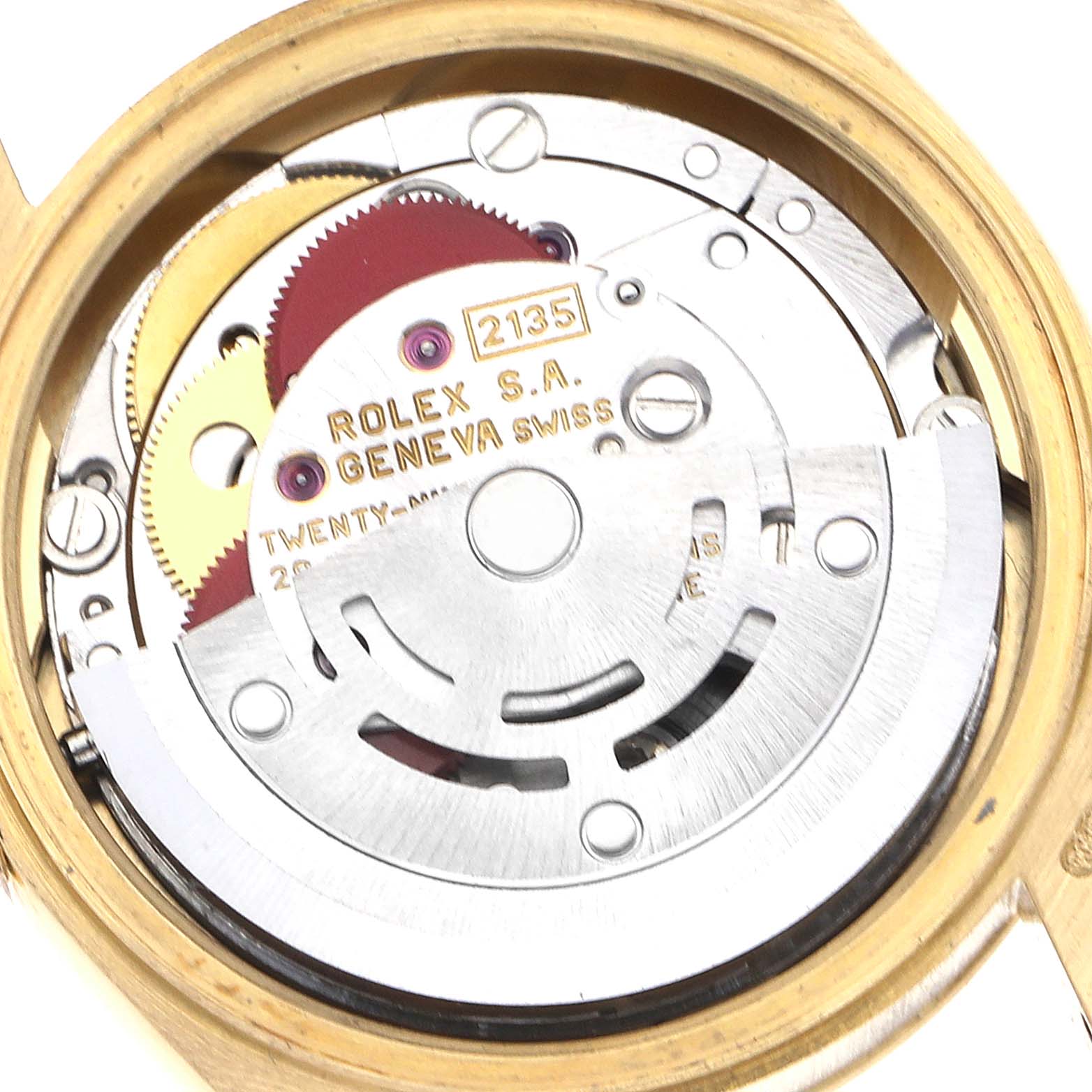 The image shows the inner movement mechanism of a Rolex President 69178 Women's Yellow Gold Champagne Dial 69178 Women's Yellow Gold Champagne Dial model, highlighting gears and the rotor from the back.