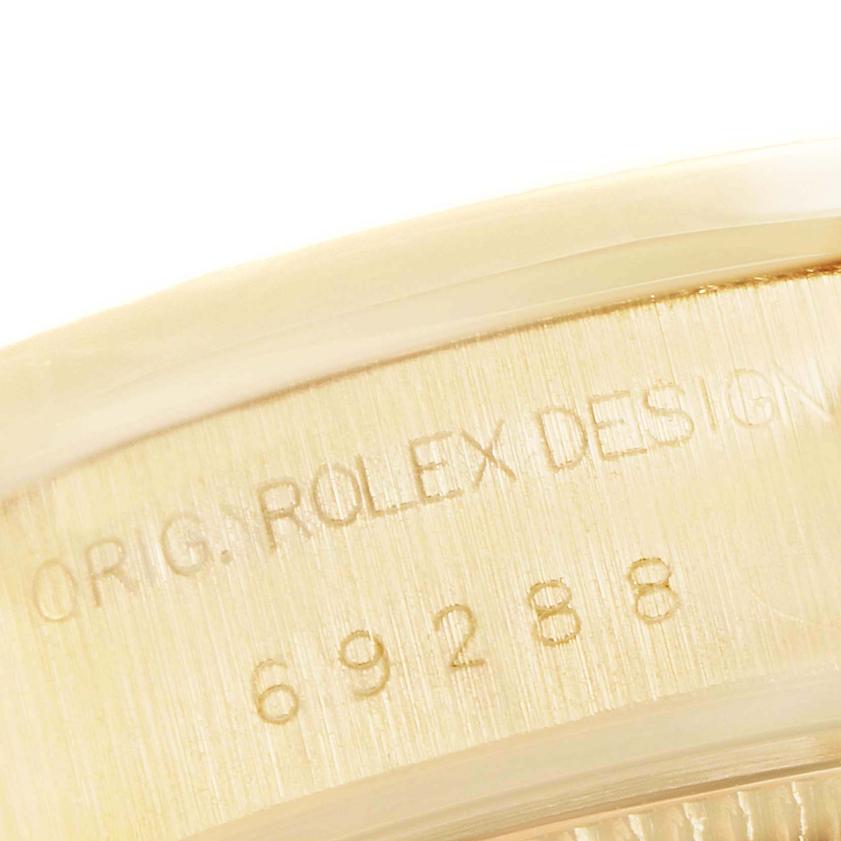 This close-up image shows the case engraving on the Rolex President 69288 Women
s Yellow Gold White Dial 69288 Women
s Yellow Gold White Dial model watch.