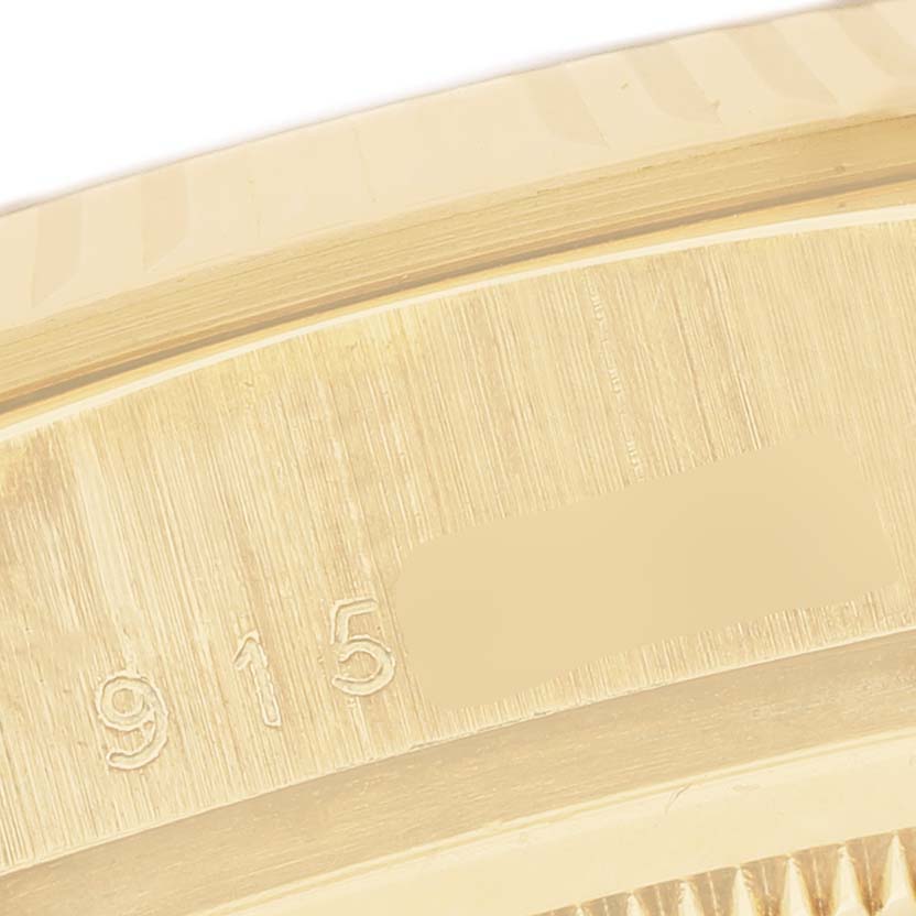 The image shows a close-up of the edge and engraved serial number on the case of the Rolex President 18038 Men's Yellow Gold Champagne Dial model watch.