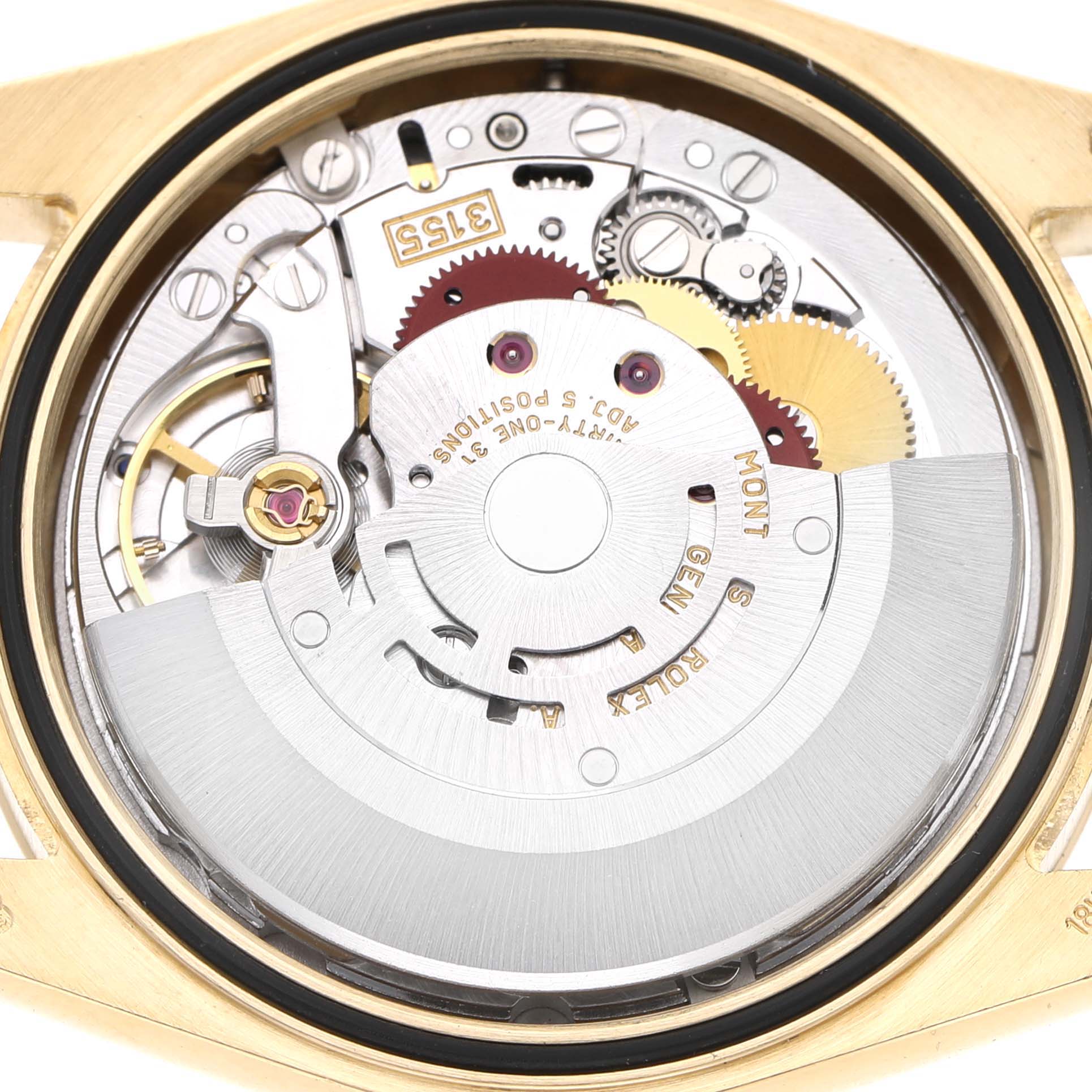 The image shows the exposed movement of a Rolex President 118238 Men's Yellow Gold Silver Dial model, highlighting gears and mechanical components.