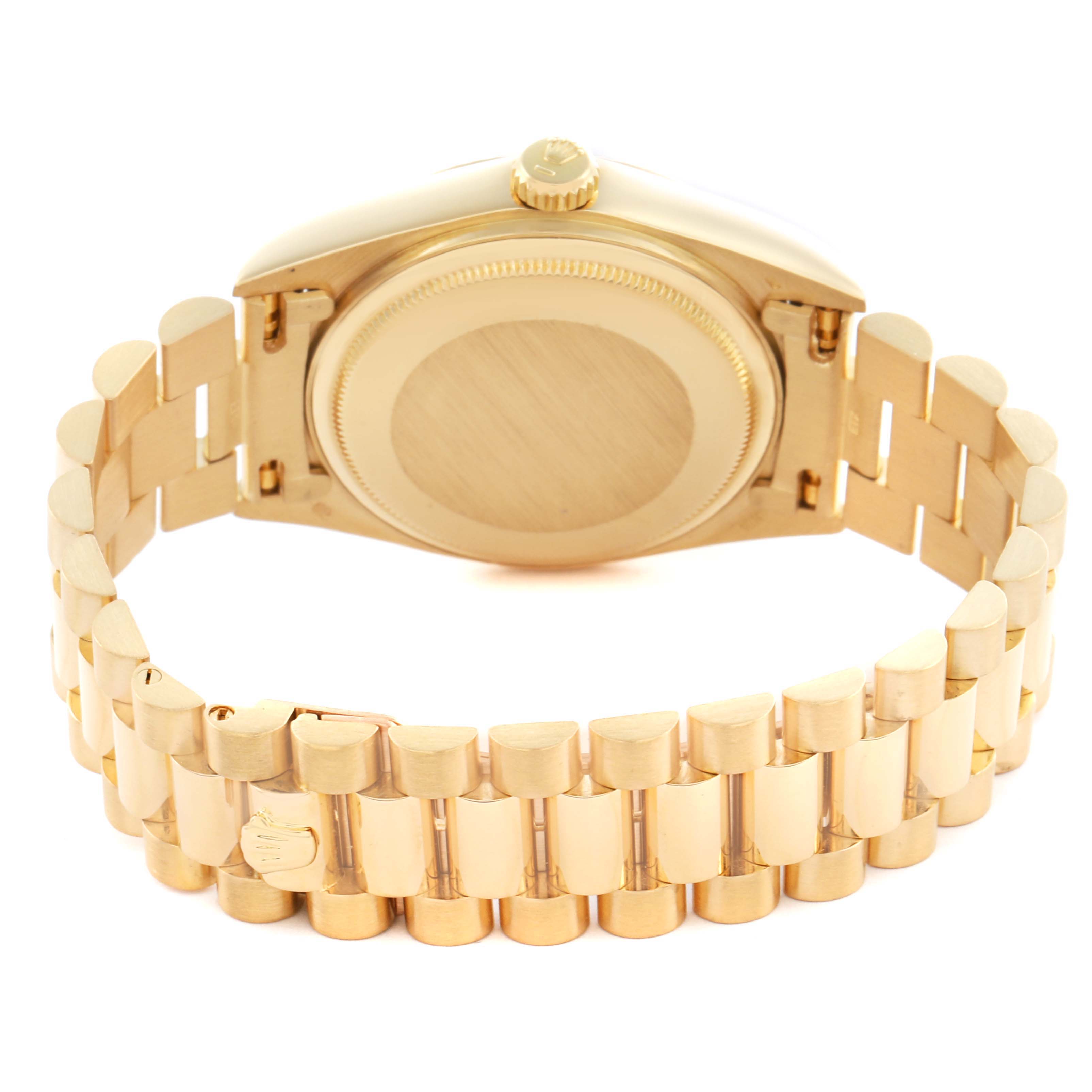 The Rolex President 18038 Men's Yellow Gold Champagne Dial 18038 Men's Yellow Gold Champagne Dial watch is shown from the back, highlighting the case back and bracelet links.