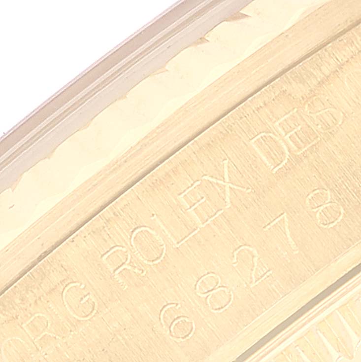The image shows a close-up of the case with engraving for the President model by Rolex.