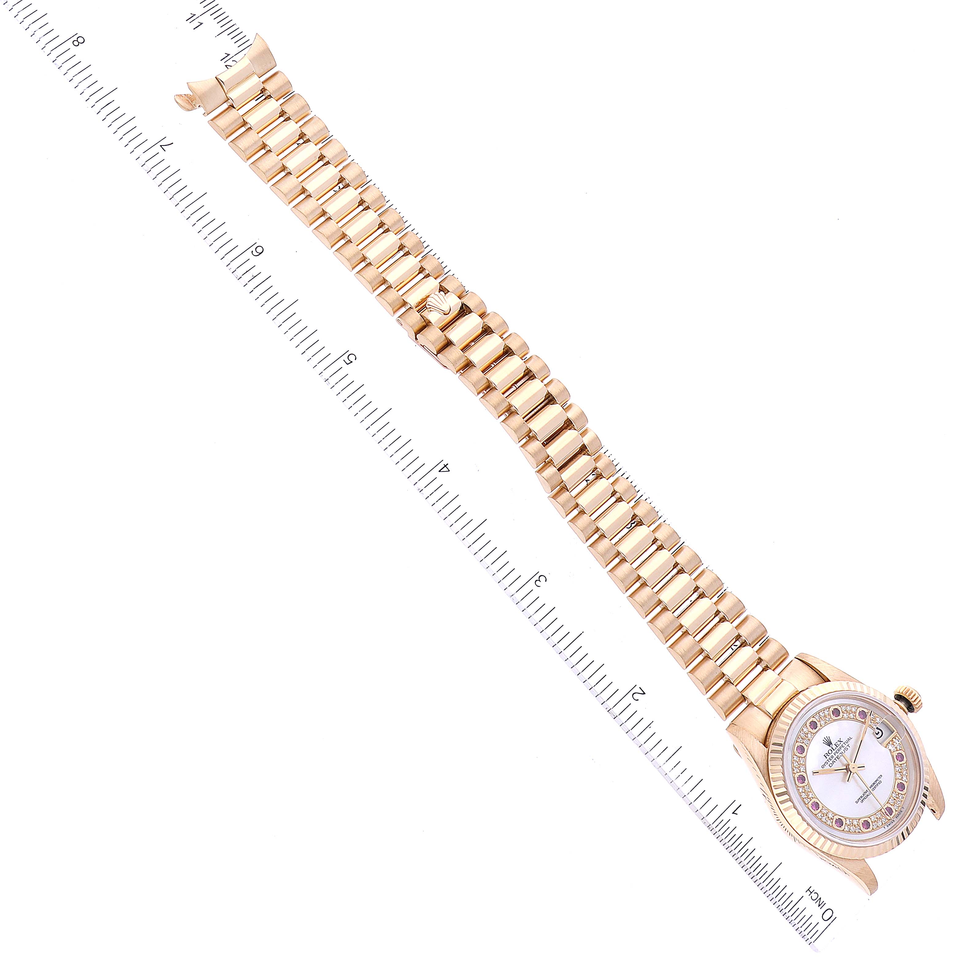 The image shows an overhead angle of a Rolex President 68278 Women's Yellow Gold Mother of Pearl Dial 68278 Women's Yellow Gold Mother of Pearl Dial model watch, highlighting its bracelet and part of the dial.