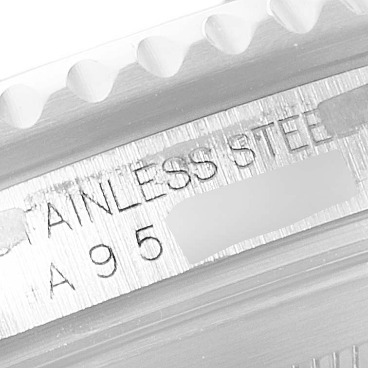 The image shows a close-up of the engraving on the bezel edge and case of a Rolex Submariner 16610 Men
s Stainless Steel Black Dial 16610 Men
s Stainless Steel Black Dial watch, highlighting "STAINLESS STEEL."