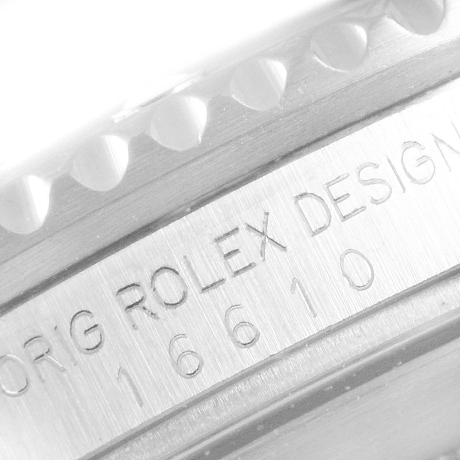 This image shows a close-up of the engraved model number and part of the bezel of a Rolex Submariner 16610 Men
s Stainless Steel Black Dial 16610 Men
s Stainless Steel Black Dial watch.