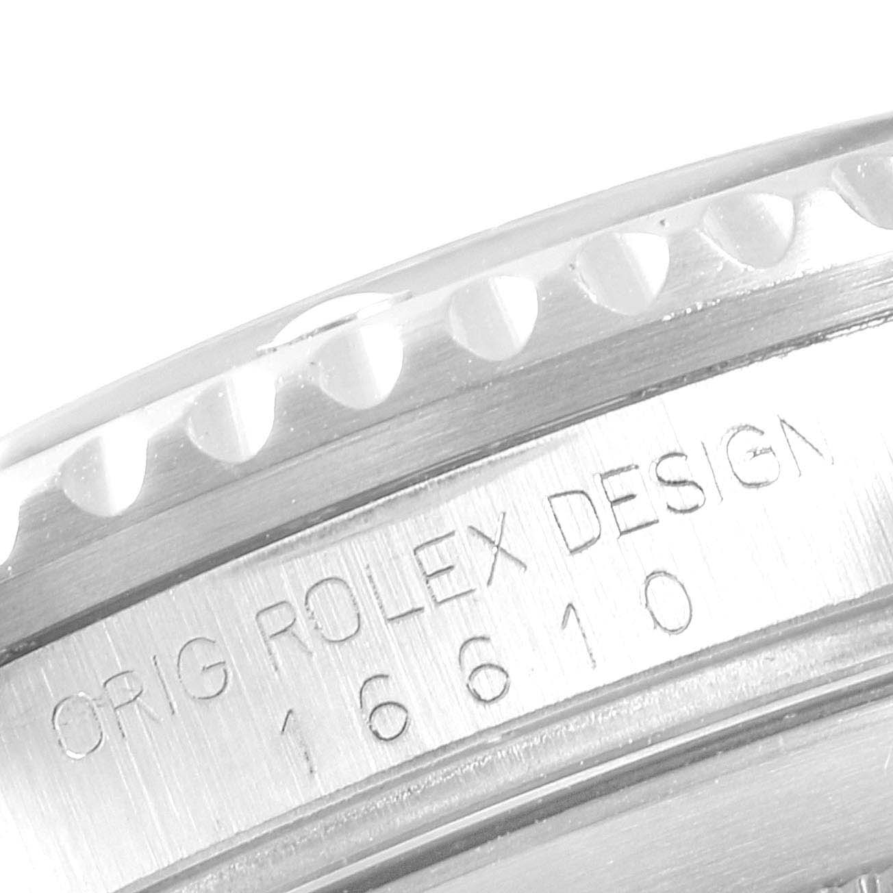 This image shows a close-up of the Rolex Submariner 16610 Men
s Stainless Steel Black Dial 16610 Men
s Stainless Steel Black Dial
s case side engraving, featuring text and the model number 16610.