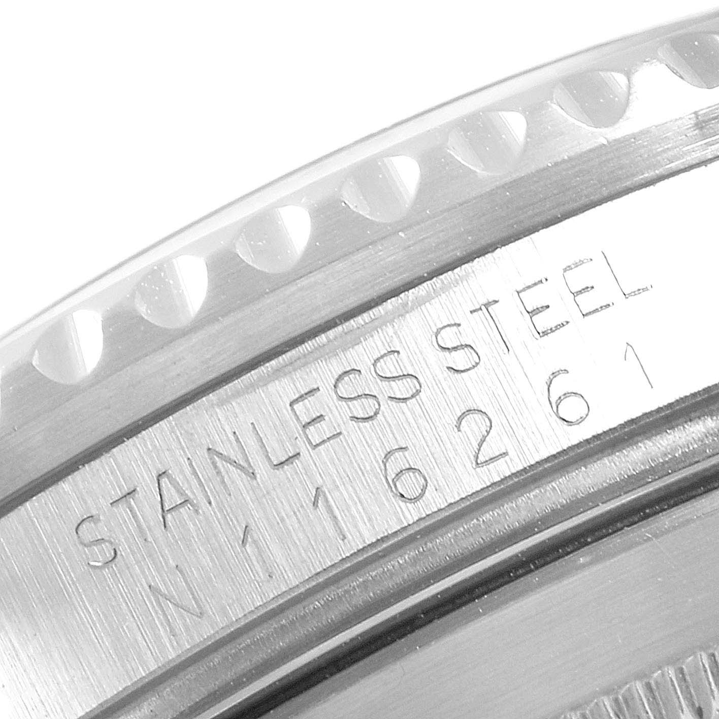 This close-up angle shows the engraved stainless steel serial markings on the side of a Rolex Submariner 16610 Men
s Stainless Steel Black Dial 16610 Men
s Stainless Steel Black Dial watch case.