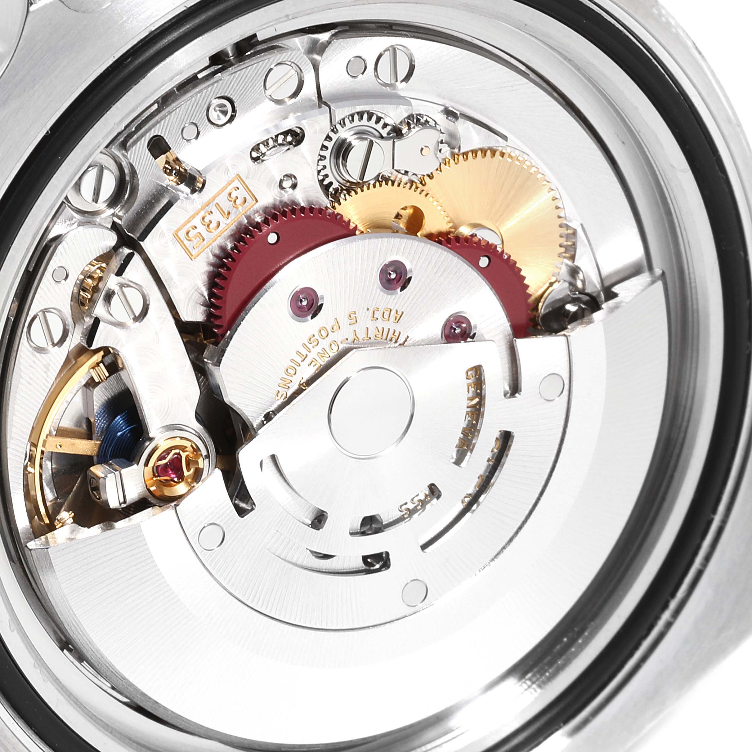 This image shows the internal mechanical movement of a Rolex Submariner 116610LV Men
s Stainless Steel Green Dial 116610LV Men
s Stainless Steel Green Dial watch, highlighting its gears and components.