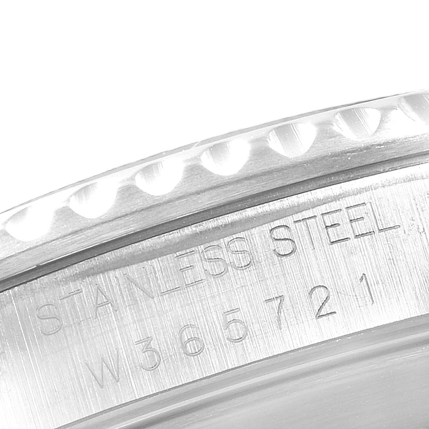This image shows a close-up of the stainless steel bezel and engraved serial number of a Rolex Submariner 14060 Men
s Stainless Steel Black Dial 14060 Men
s Stainless Steel Black Dial watch.