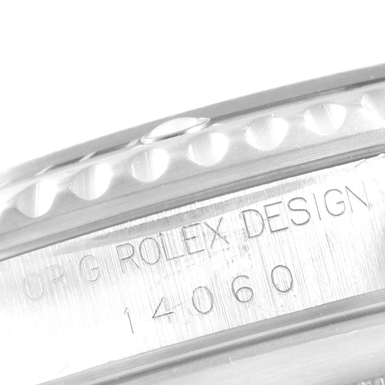The image shows a close-up of the engraving on the side of the Rolex Submariner 14060 Men
s Stainless Steel Black Dial 14060 Men
s Stainless Steel Black Dial, indicating its model number 14060.