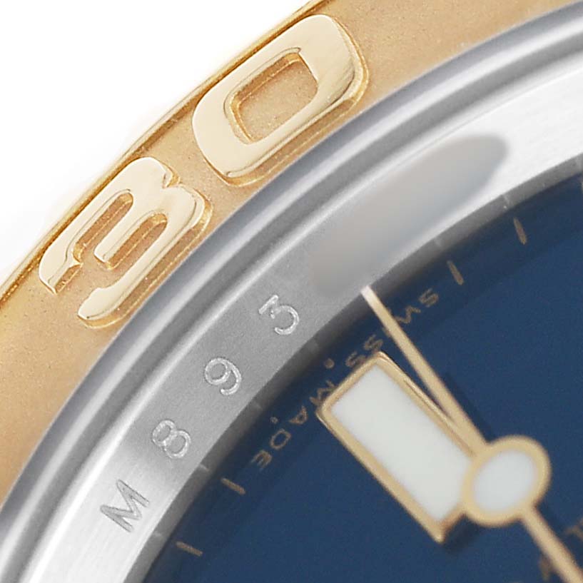 The image shows a close-up of the bezel and part of the dial of a Rolex Yacht-Master 16623 Men's Steel and Gold (two tone) Blue Dial, highlighting gold accents.