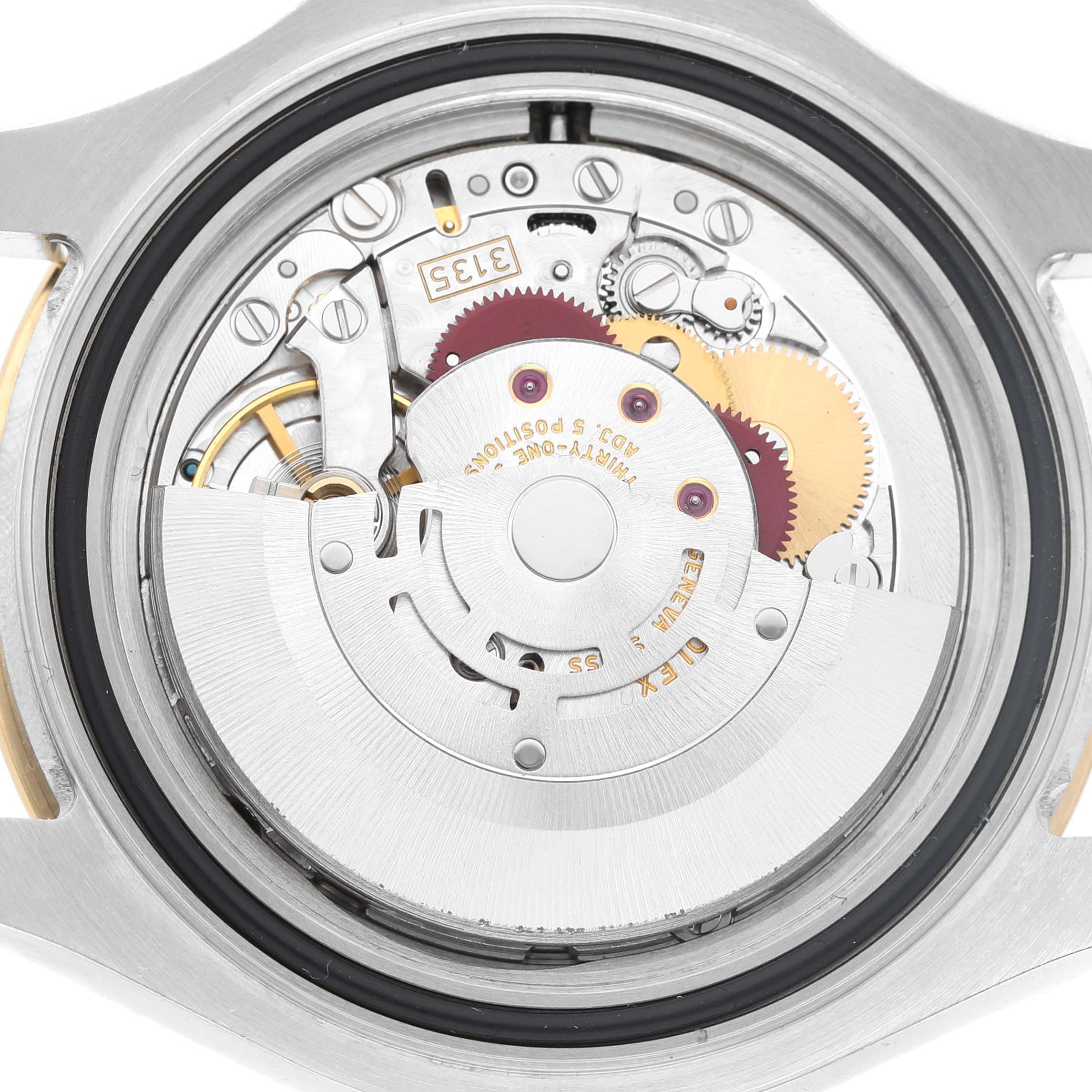 The image shows the movement of a Rolex Yacht-Master 16623 Men's Steel and Gold (two tone) Blue Dial watch, viewed from the back, highlighting gears and the rotor.