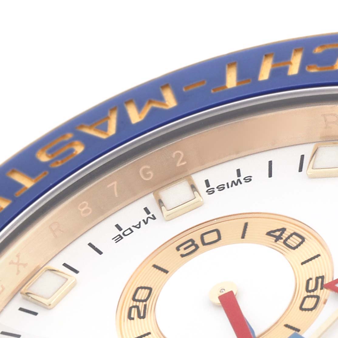 The image shows a close-up of the Rolex Yacht-Master 116688 Men's Yellow Gold White Dial 116688 Men's Yellow Gold White Dial bezel and part of the dial with numerals and indices.