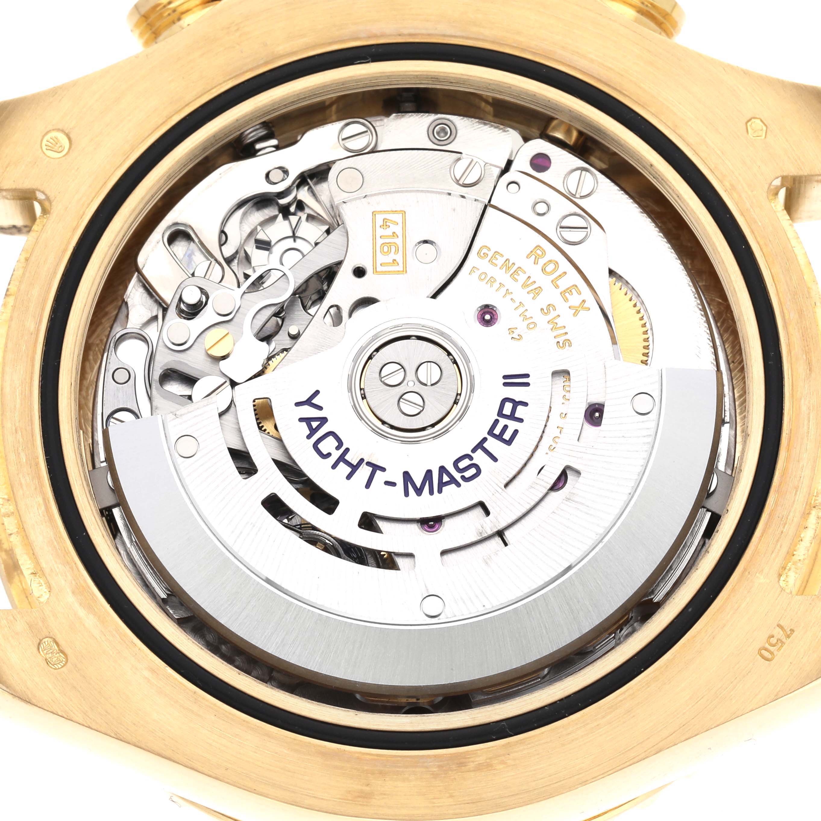 The image shows the movement of a Rolex Yacht-Master 116688 Men's Yellow Gold White Dial 116688 Men's Yellow Gold White Dial watch from the back, highlighting its intricate mechanics.