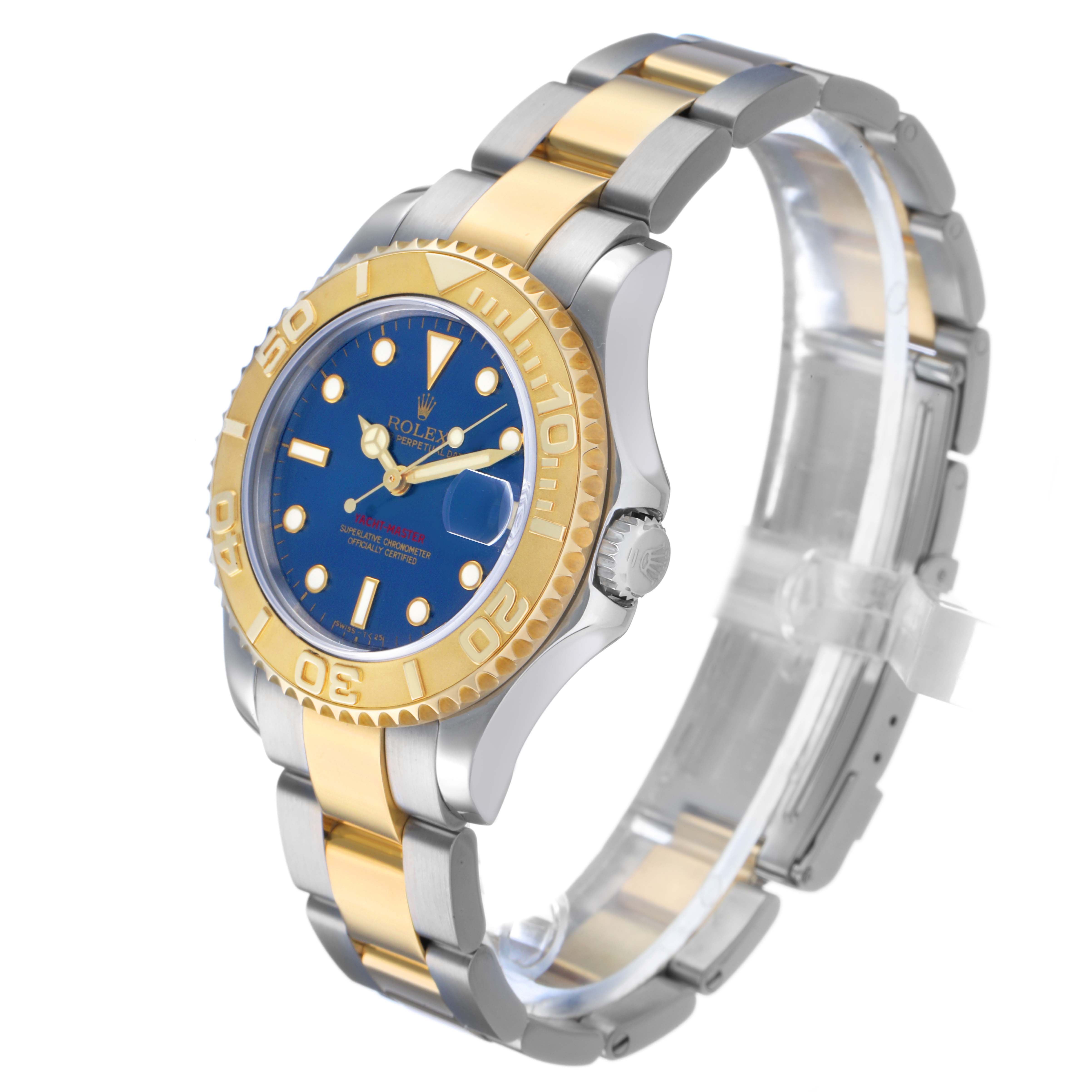 The Rolex Yacht-Master 68623 Men's Steel and Gold (two tone) Blue Dial watch is shown at a three-quarter angle, highlighting the face, bezel, and part of the bracelet.