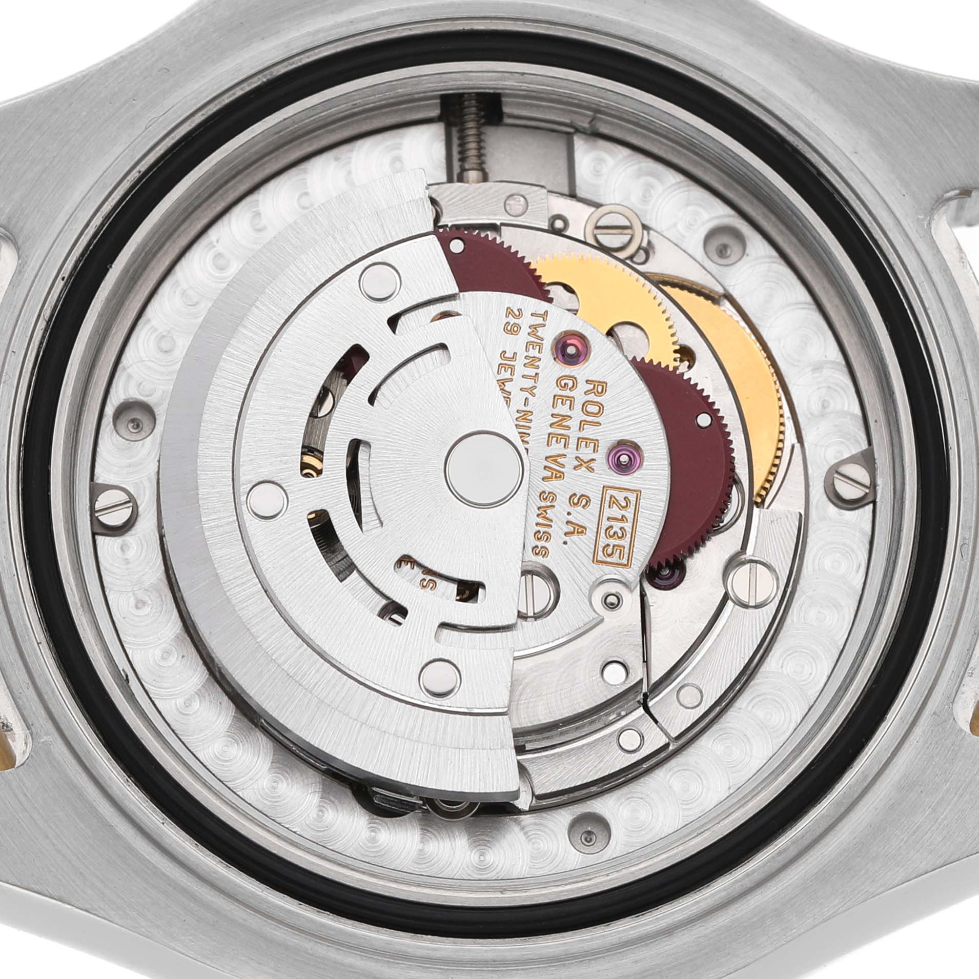 This image shows the movement mechanism of a Rolex Yacht-Master 68623 Men's Steel and Gold (two tone) Blue Dial watch from the back, revealing intricate gears and components.
