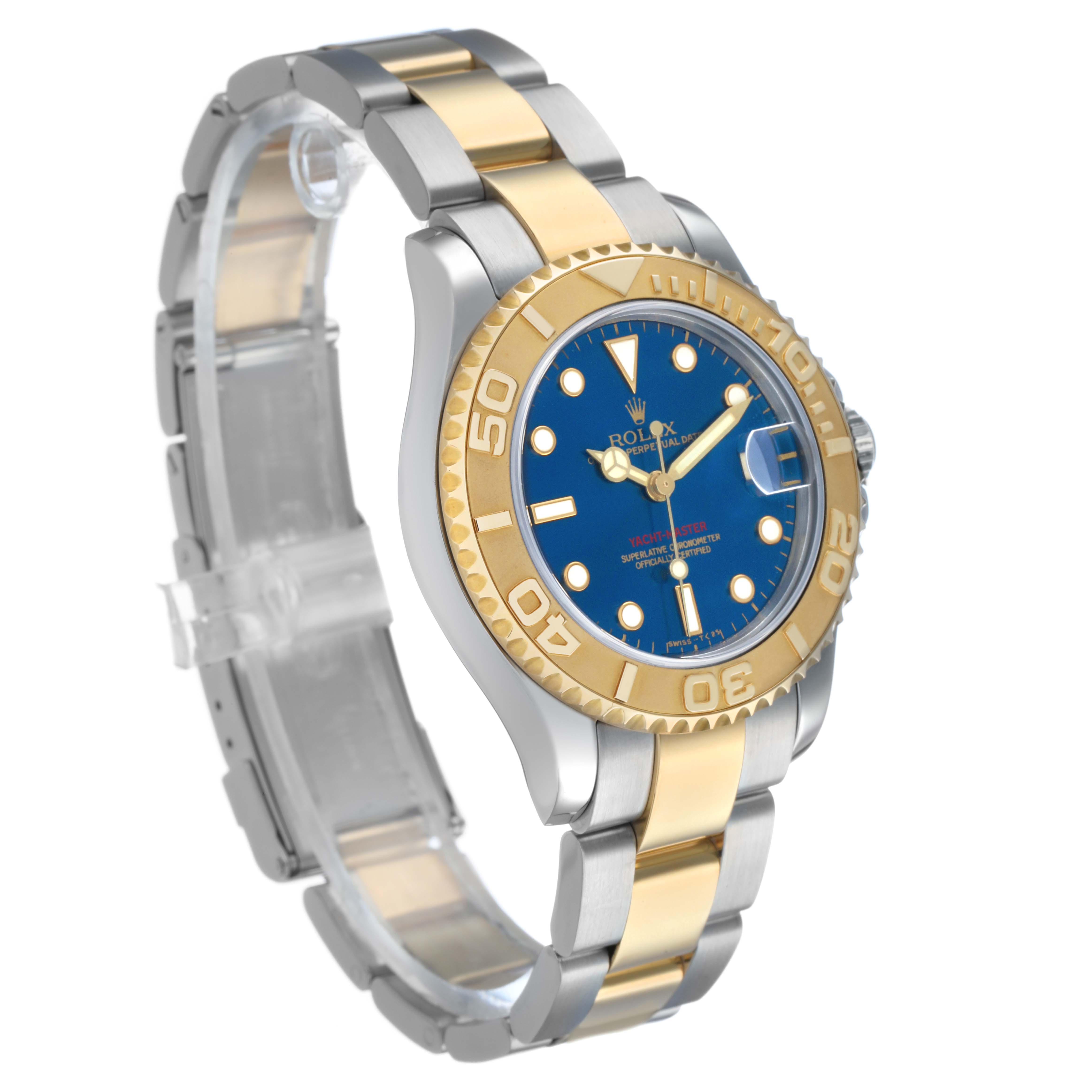 The Rolex Yacht-Master 68623 Men's Steel and Gold (two tone) Blue Dial watch is shown at a three-quarter angle featuring the bezel, dial, and oyster bracelet.