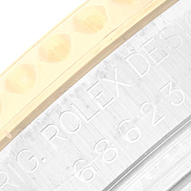 This close-up image shows the bezel and engraved side of a Rolex Yacht-Master 168623 Men's Steel and Gold (two tone) Blue Dial 168623 Men's Steel and Gold (two tone) Blue Dial watch.