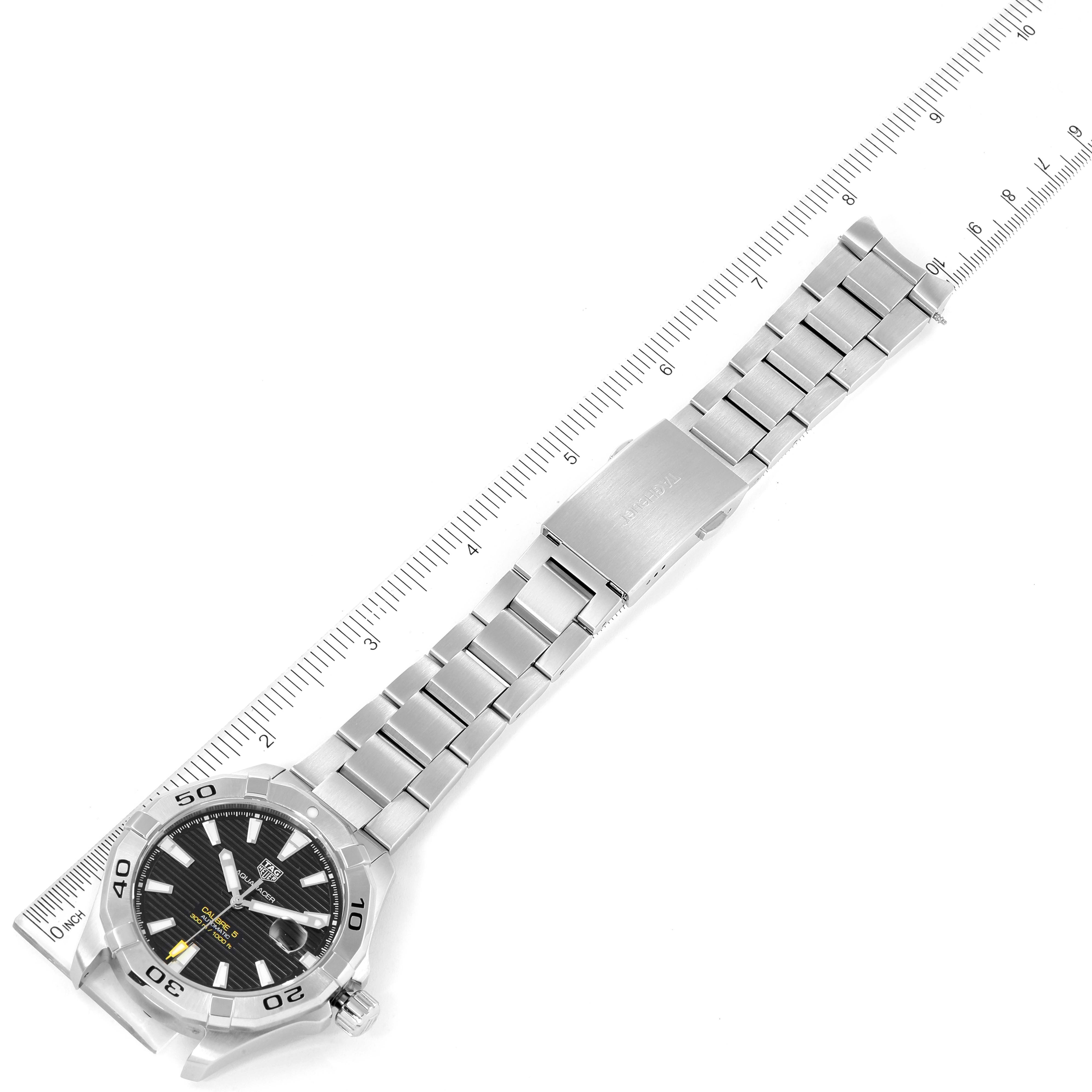 The image shows a Tag Heuer Aquaracer WAY2010.BA0927 Men's Stainless Steel Black Dial WAY2010.BA0927 Men's Stainless Steel Black Dial watch laid flat with a measuring ruler beside it.