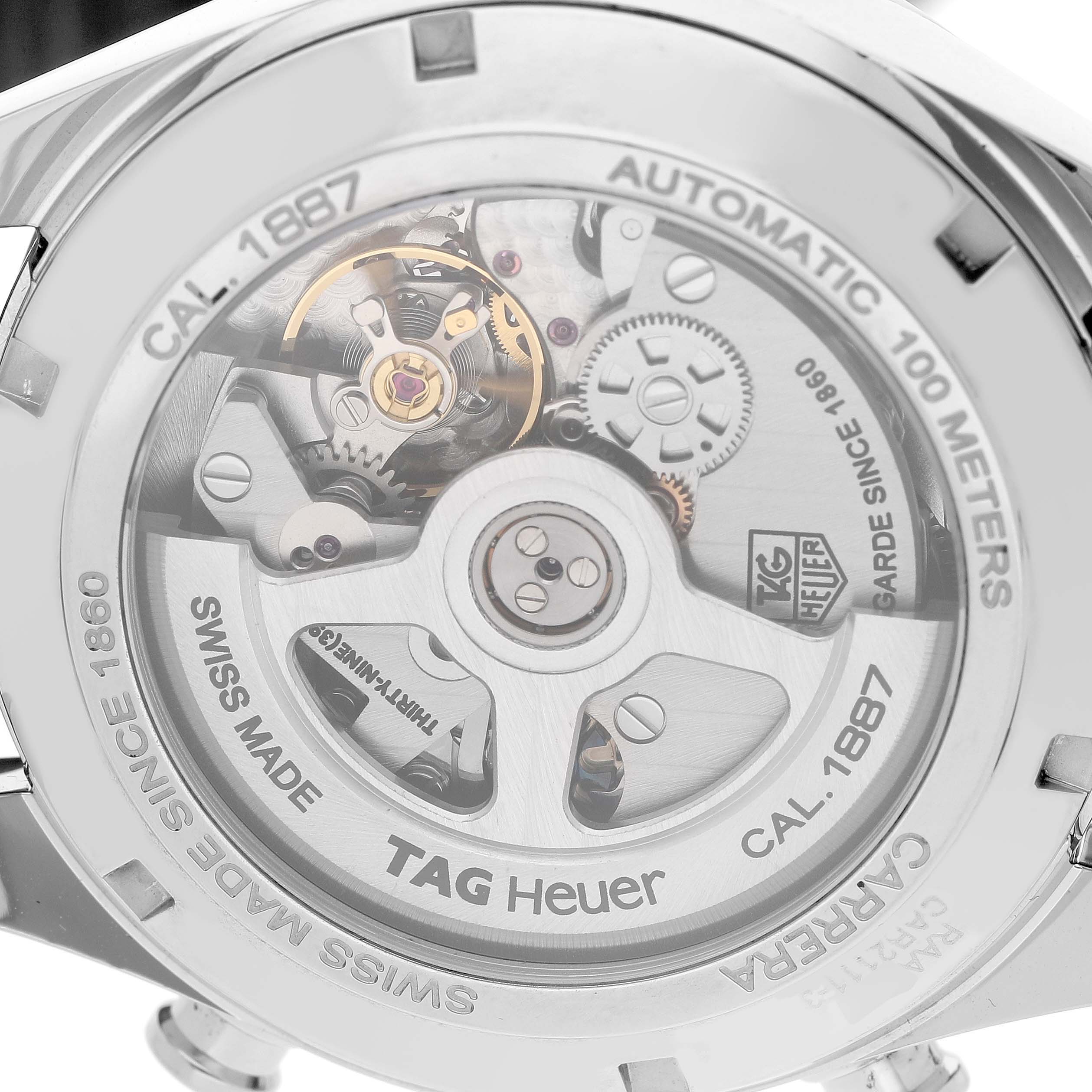 The image shows the back of a Tag Heuer Carrera CAR2111-3 Men's Stainless Steel Silver Dial watch, highlighting its automatic movement and inner workings.