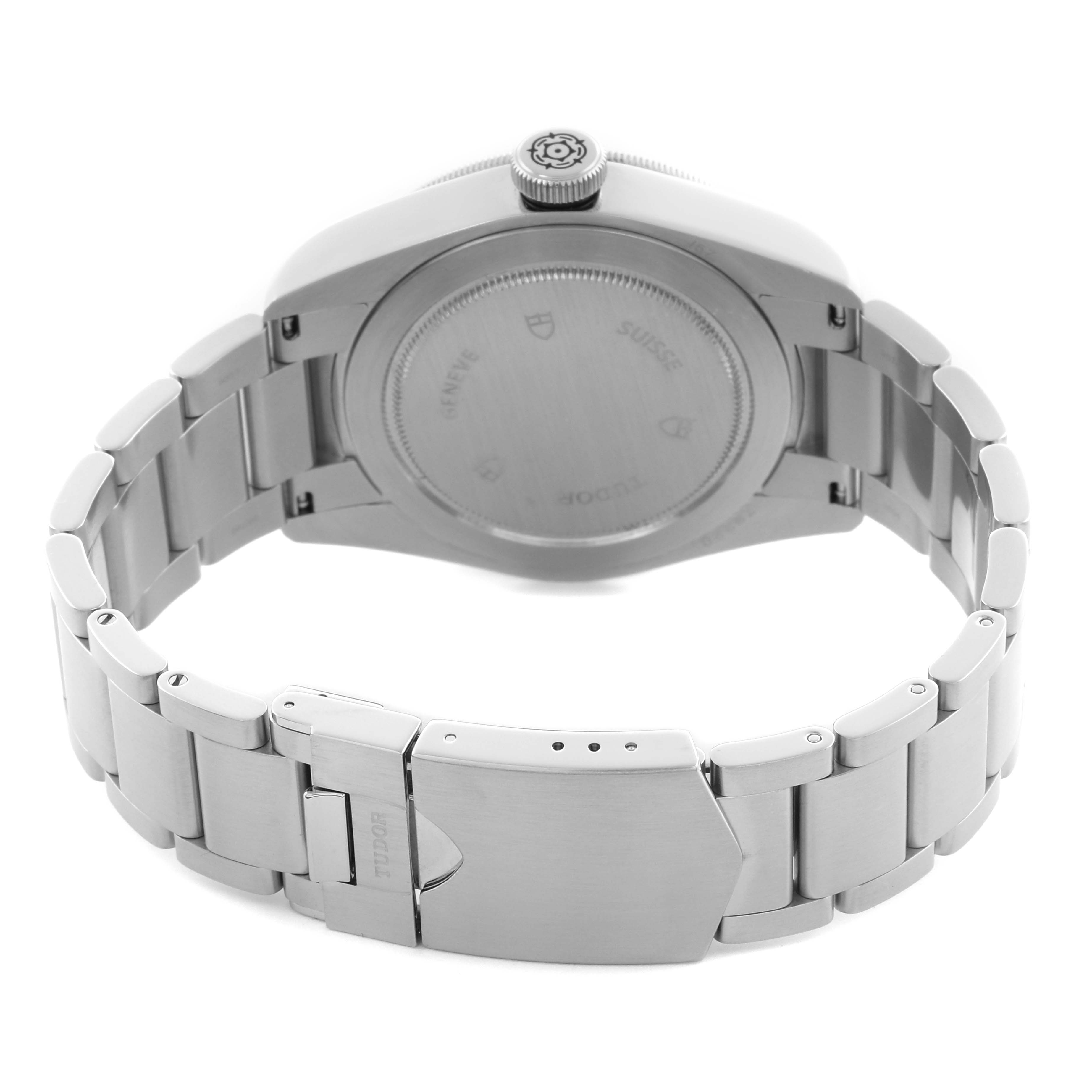 The Tudor Heritage Black Bay 79220N Men's Stainless Steel Black Dial 79220N Men's Stainless Steel Black Dial watch is shown from the back, highlighting its case back, crown, and metal bracelet with a clasp.