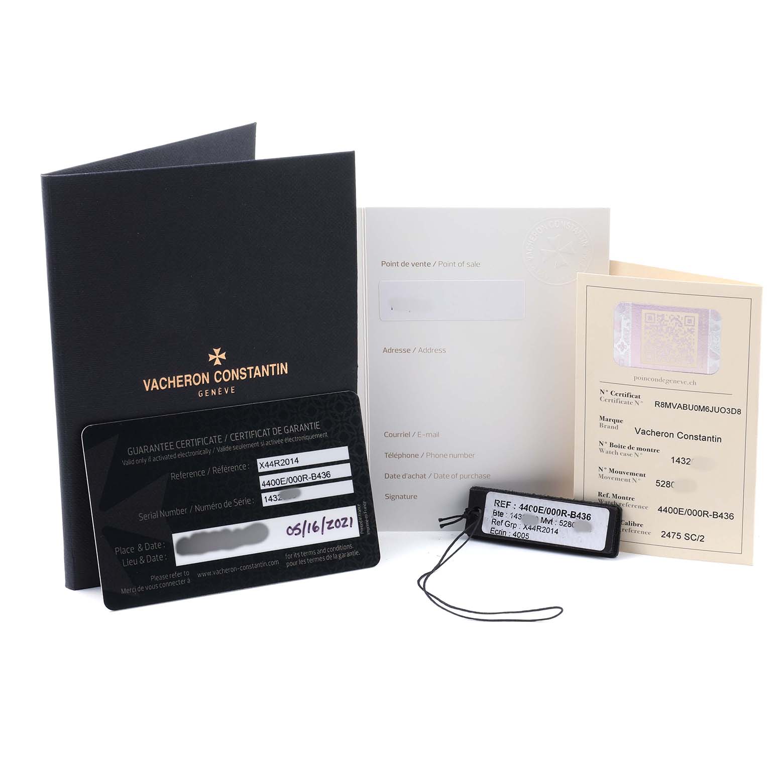 This image shows documents and a tag for the Vacheron Constantin Fiftysix 4400E/000R-B436 X44R2014 Men's Rose Gold Silver Dial watch, including warranty cards and certificates.