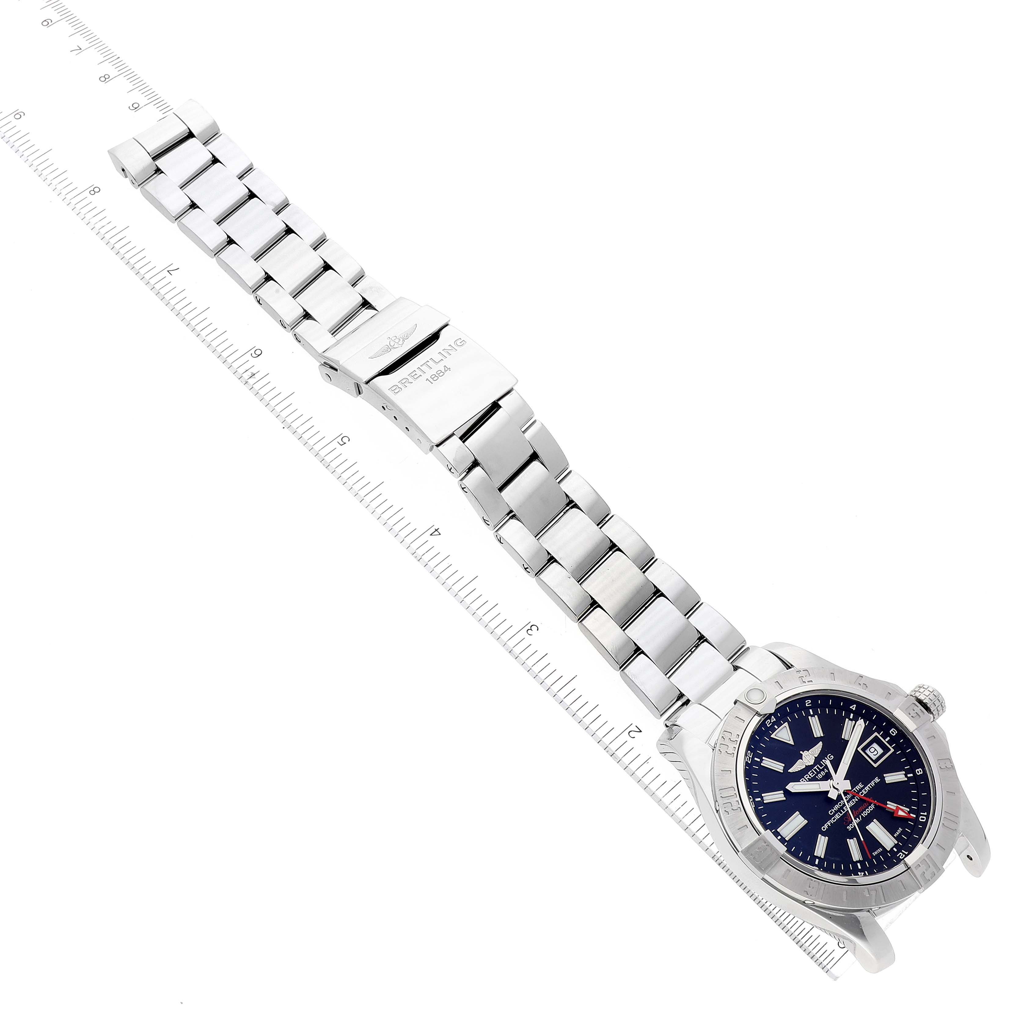 The Breitling Avenger A32390 Men's Stainless Steel Black Dial A32390 Men's Stainless Steel Black Dial watch is shown from an angled top view highlighting its face, bracelet, and clasp with a ruler for scale.