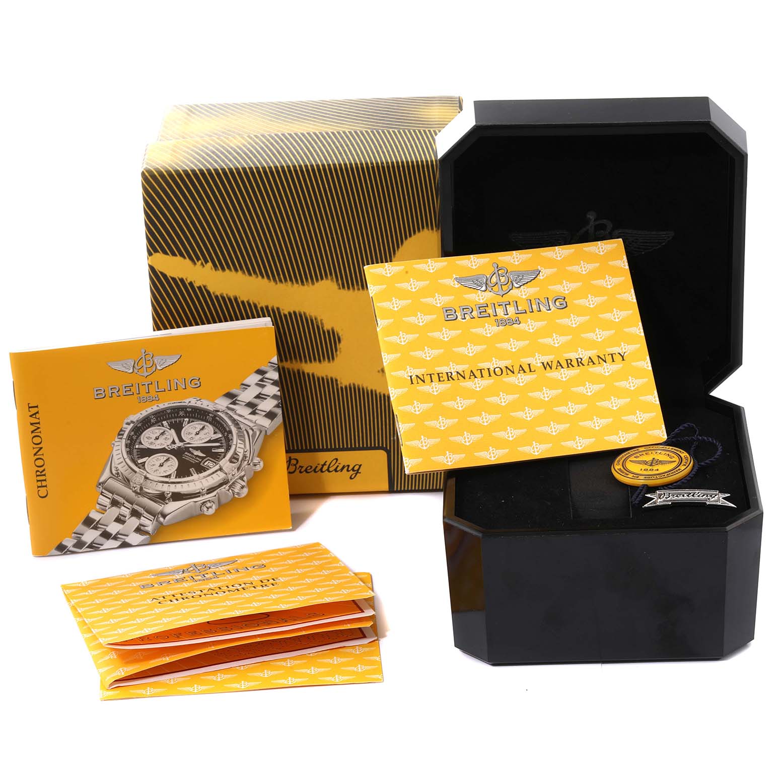 The image shows the packaging, international warranty, and manuals for the Breitling Chronomat D1335212/A538 Men
s Stainless Steel White Dial D1335212/A538 Men
s Stainless Steel White Dial watch, including the box and papers.