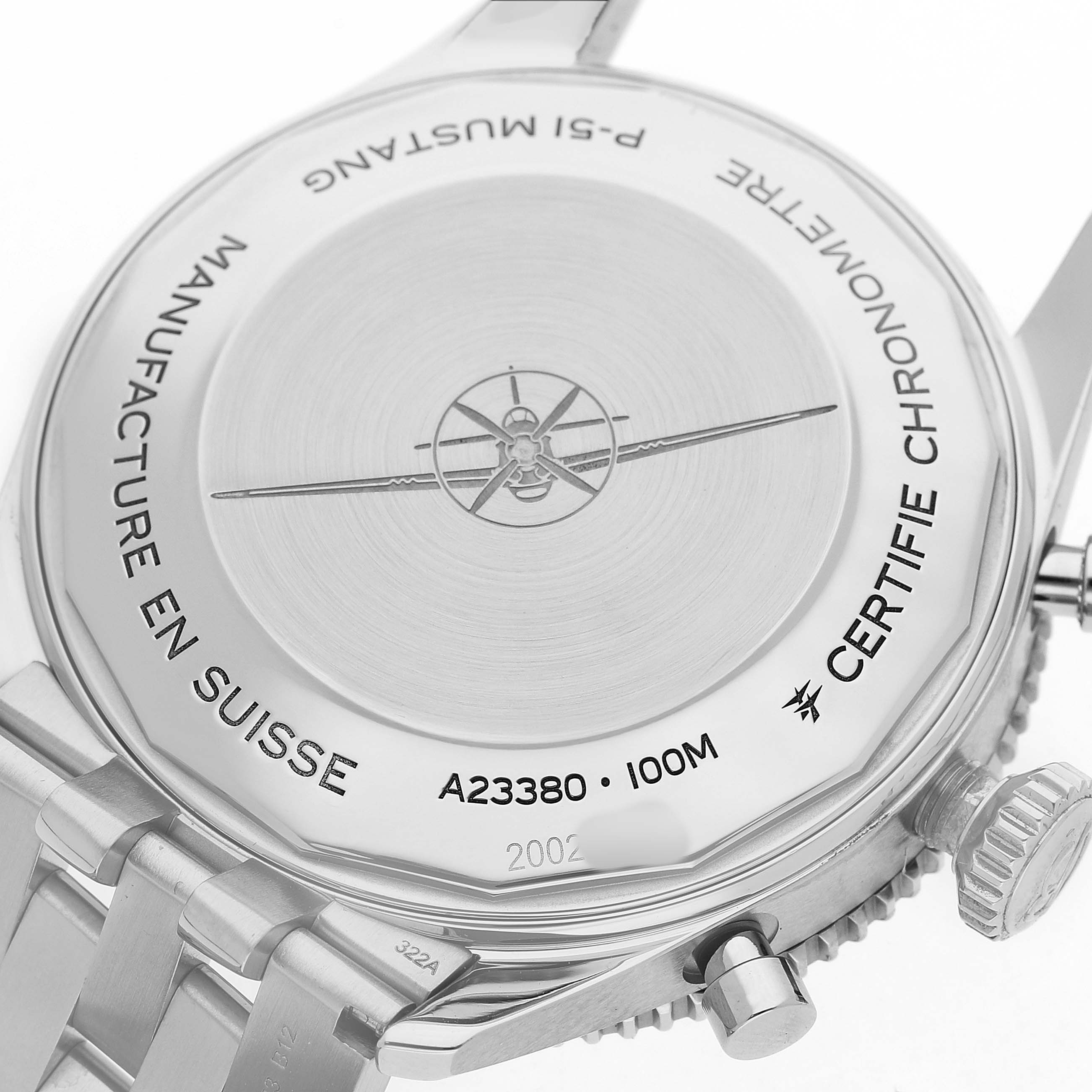 The image shows the back case of the Breitling Aviator A23380 Men's Stainless Steel Black Dial watch, highlighting engravings and the metal bracelet links.