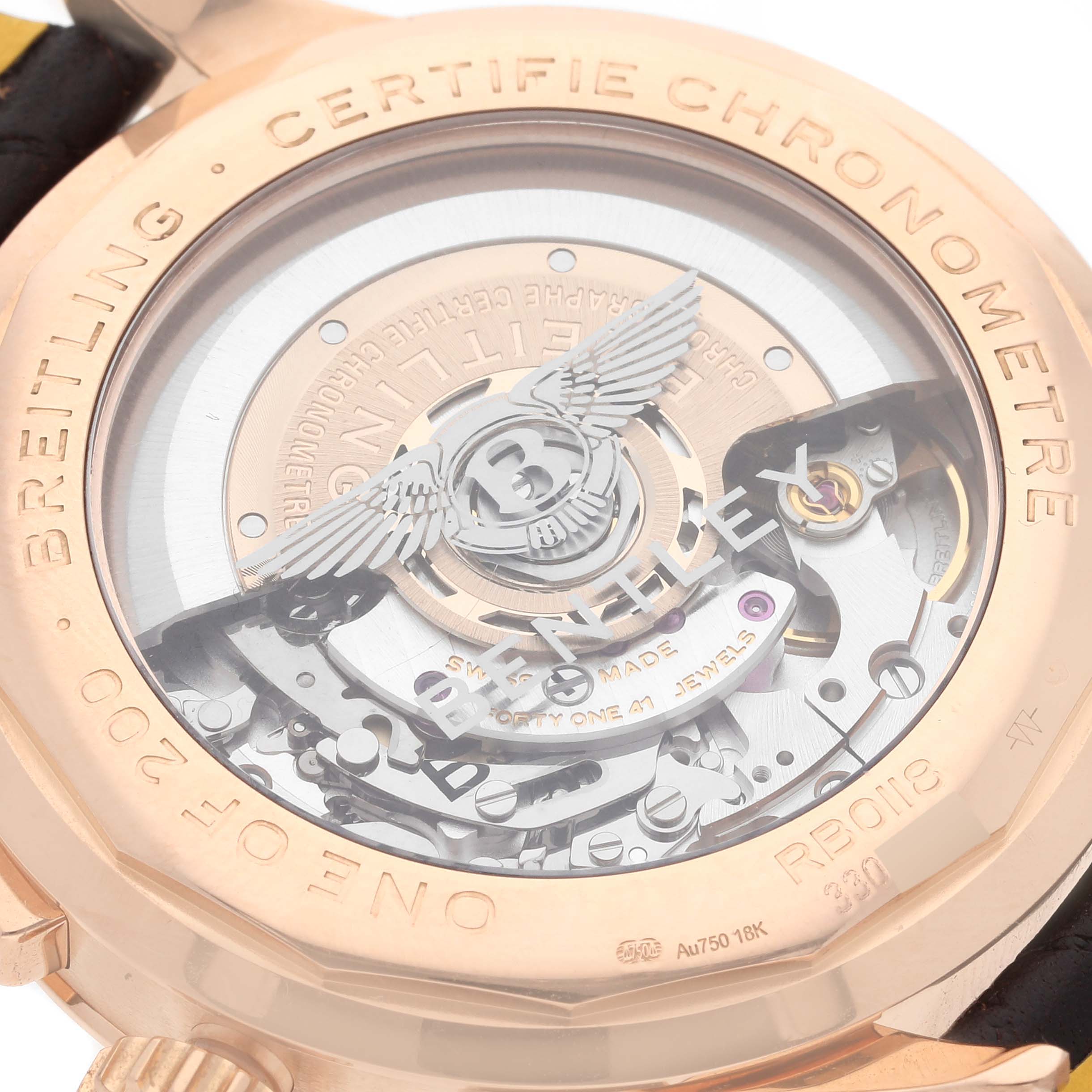 The image shows the back of the Breitling Limited Series watch, featuring its intricate movement and "Certifie Chronometre" engraving.